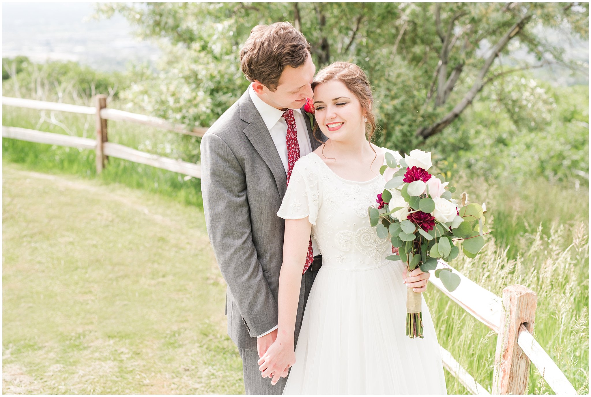 Bride and groom portraits with white fence | Grey, Burgundy, and Gold Wedding | Draper Temple and South Mountain Wedding | Utah Wedding Photographers | Jessie and Dallin Photography