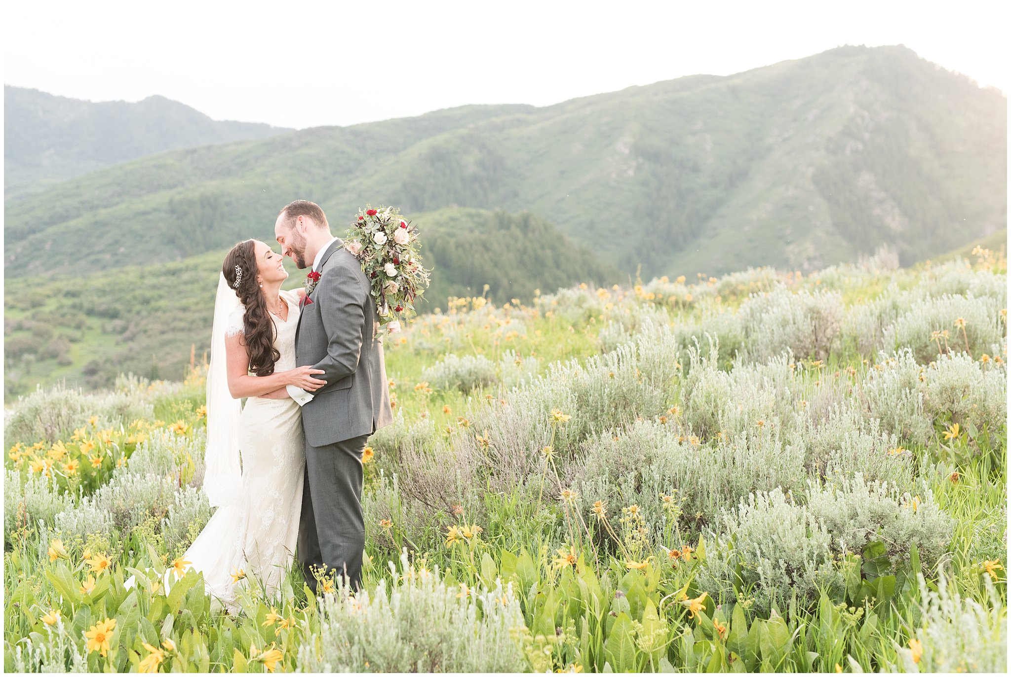 Bride and groom portraits in the mountains | Groom in grey suit and bride in beige and white dress with waterfall bouquet | Snowbasin Summer Formal Session | Utah Wedding Photographers | Jessie and Dallin