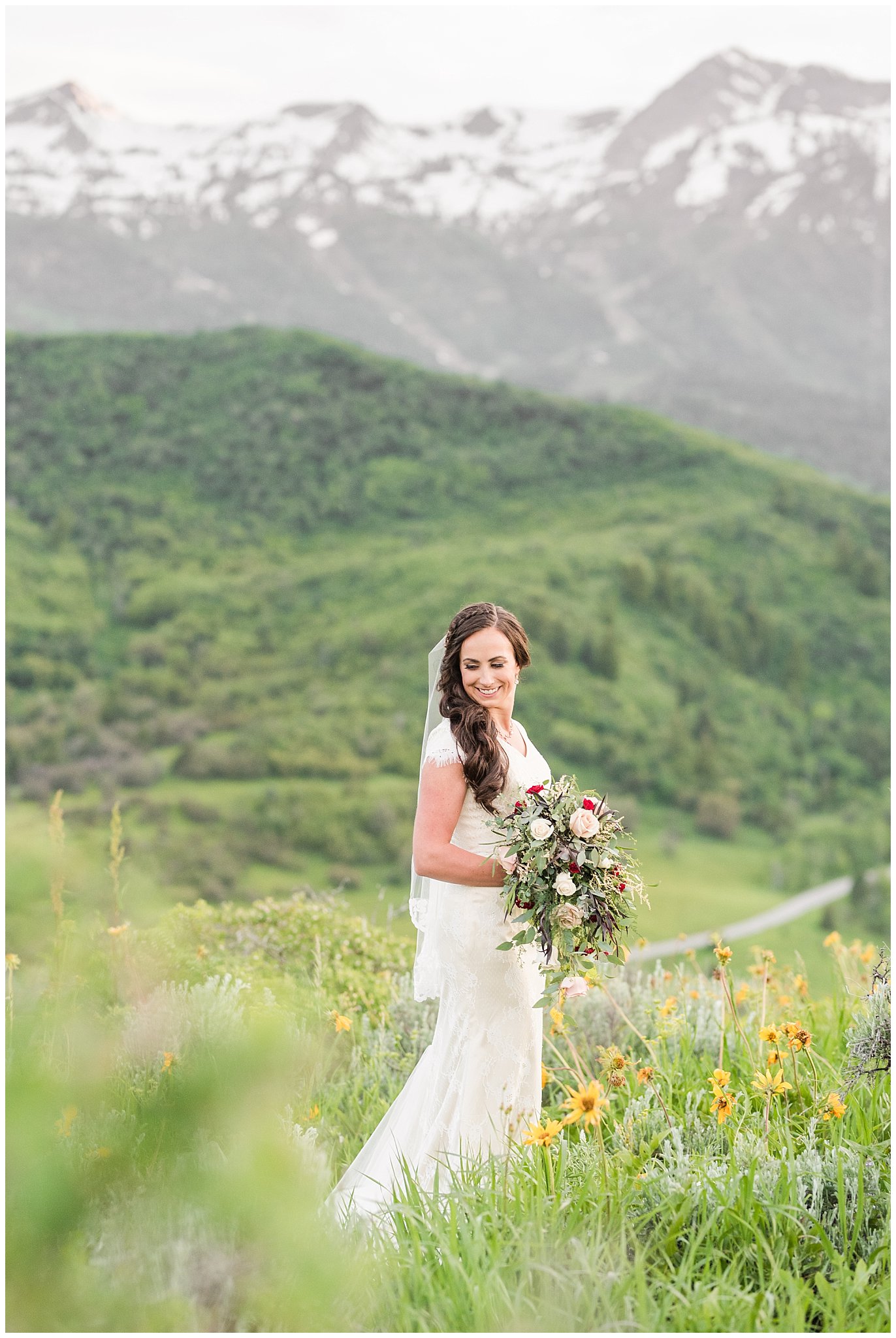 Bridal portraits in the mountains | Groom in grey suit and bride in beige and white dress with waterfall bouquet | Snowbasin Summer Formal Session | Utah Wedding Photographers | Jessie and Dallin