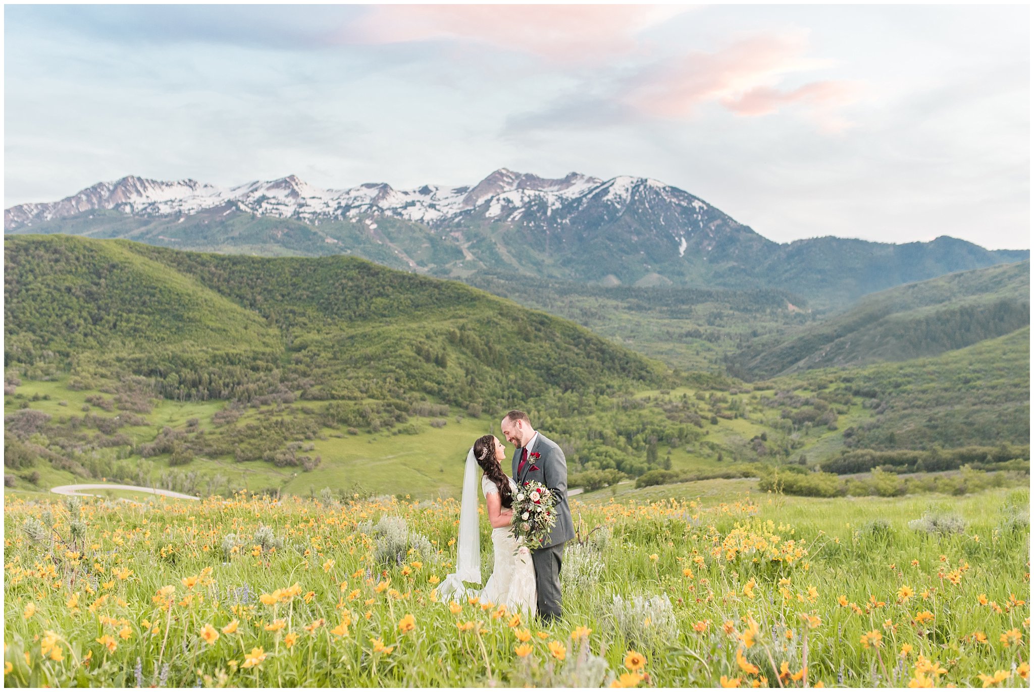 Bride and groom portraits in the mountains with a sunset | Groom in grey suit and bride in beige and white dress with waterfall bouquet | Snowbasin Summer Formal Session | Utah Wedding Photographers | Jessie and Dallin