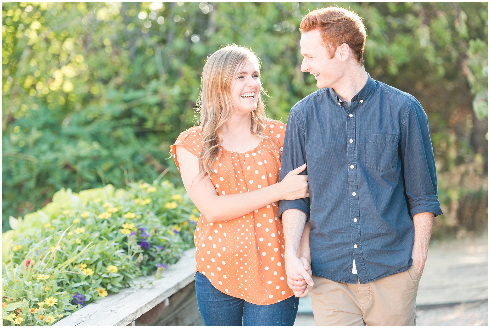 Couple wearing causal outfit during candid engagement photos in a Utah garden | Kaysville Botanical Garden Engagement | Utah Engagement | Jessie and Dallin Photography
