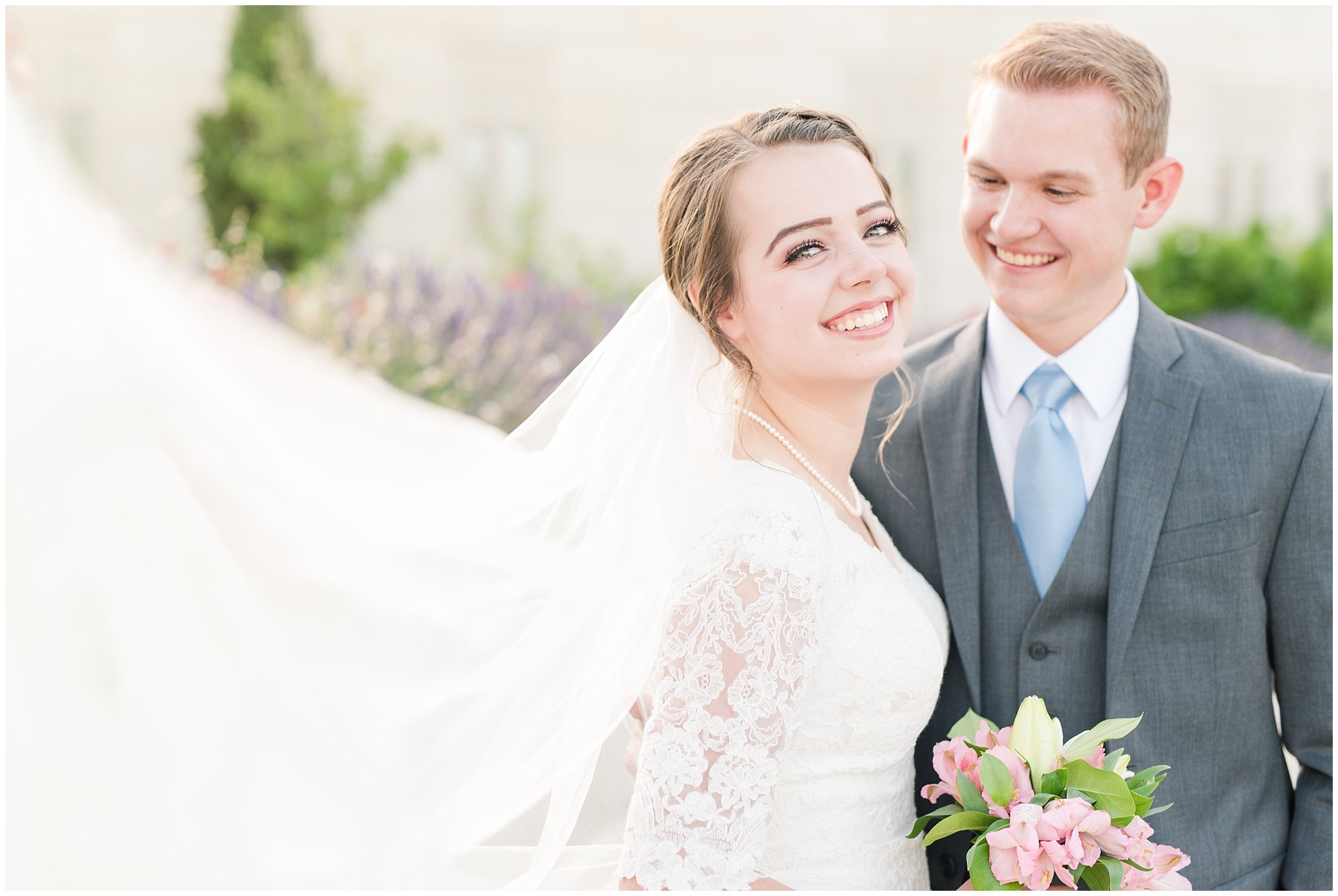 Bride with lace wedding dress and veil and groom wearing grey suit with light blue tie | bride and groom portraits | Ogden Temple Summer Wedding | Jessie and Dallin Photography