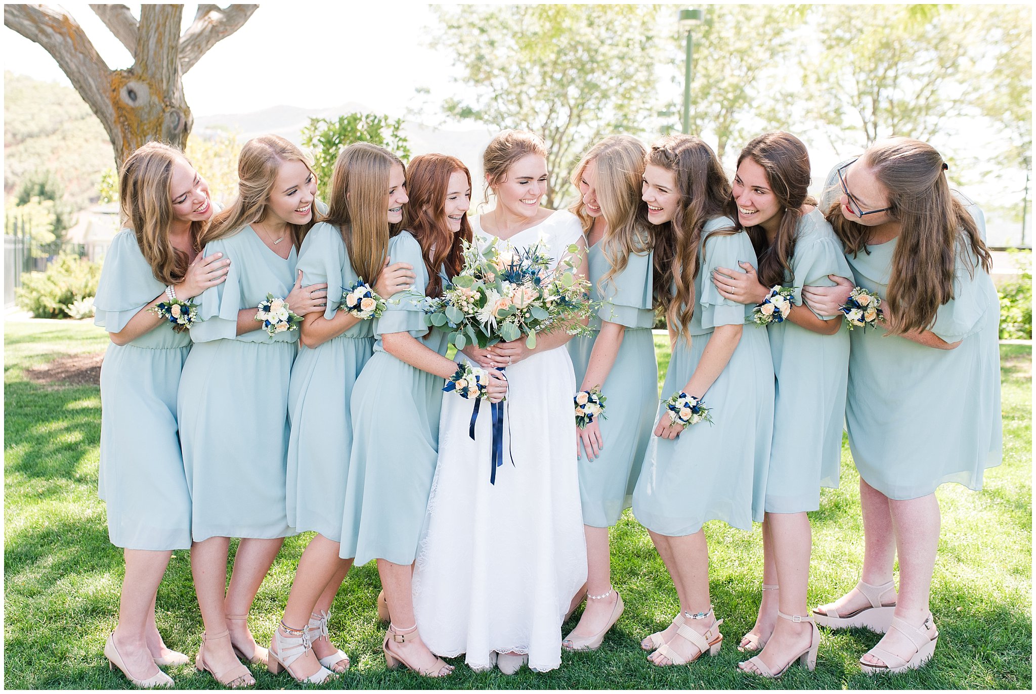 Bride with bridesmaids wearing sage dresses with corsages on wrists | Bountiful Temple Wedding and Oak Hills Reception | Jessie and Dallin Photography