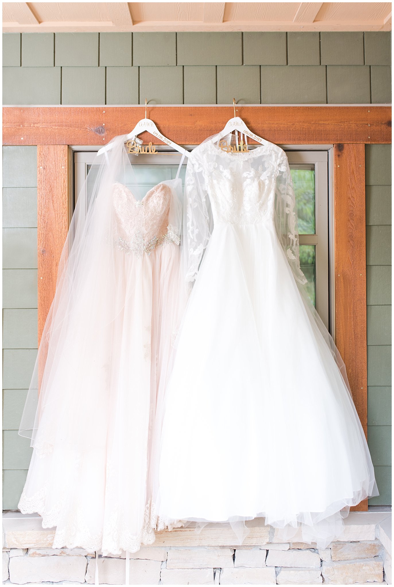 Wedding dresses hanging on wooden window | Park City Wedding at the Hyatt Centric | Jessie and Dallin Photography