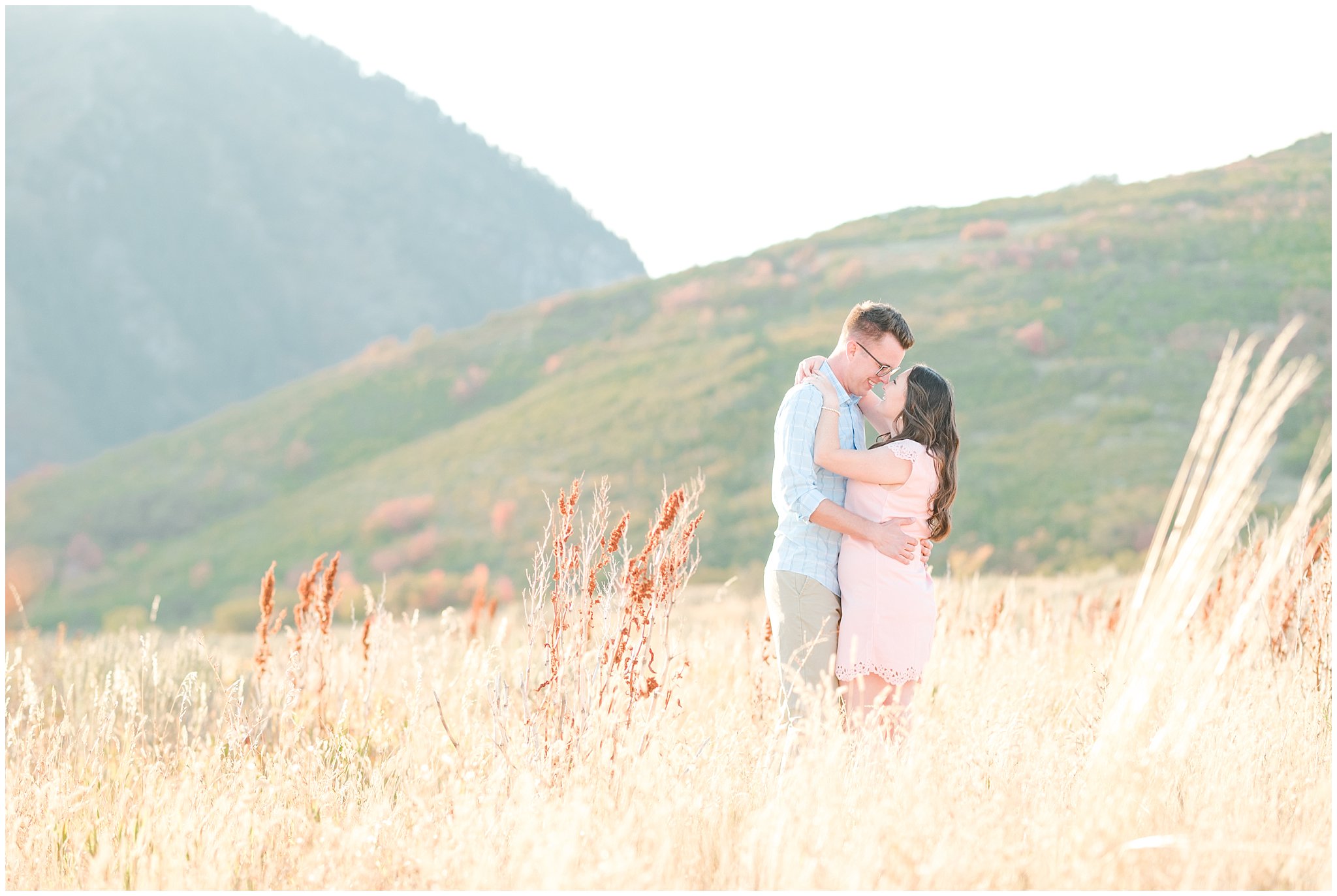 Couple in light blue shirt, tan pants and blush dress | Engagement in the Utah mountains surrounded by fall color | A Classic Snowbasin Fall Engagement Session | Jessie and Dallin Photography