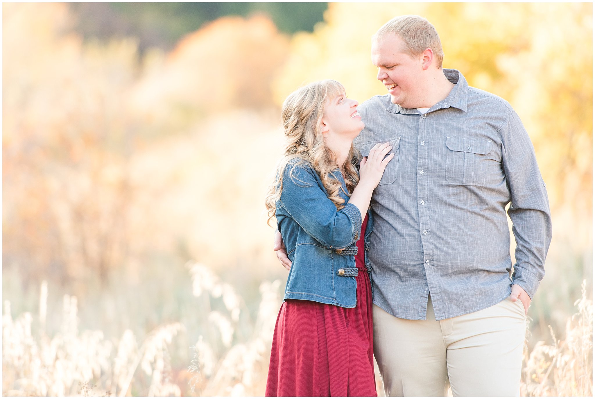 Couple dressed up with girl in burgundy dress with jean jacket and guy in grey shirt and light colored pants | Trapper's Loop Fall Engagement Session | Snowbasin Utah Mountains | Jessie and Dallin Photography