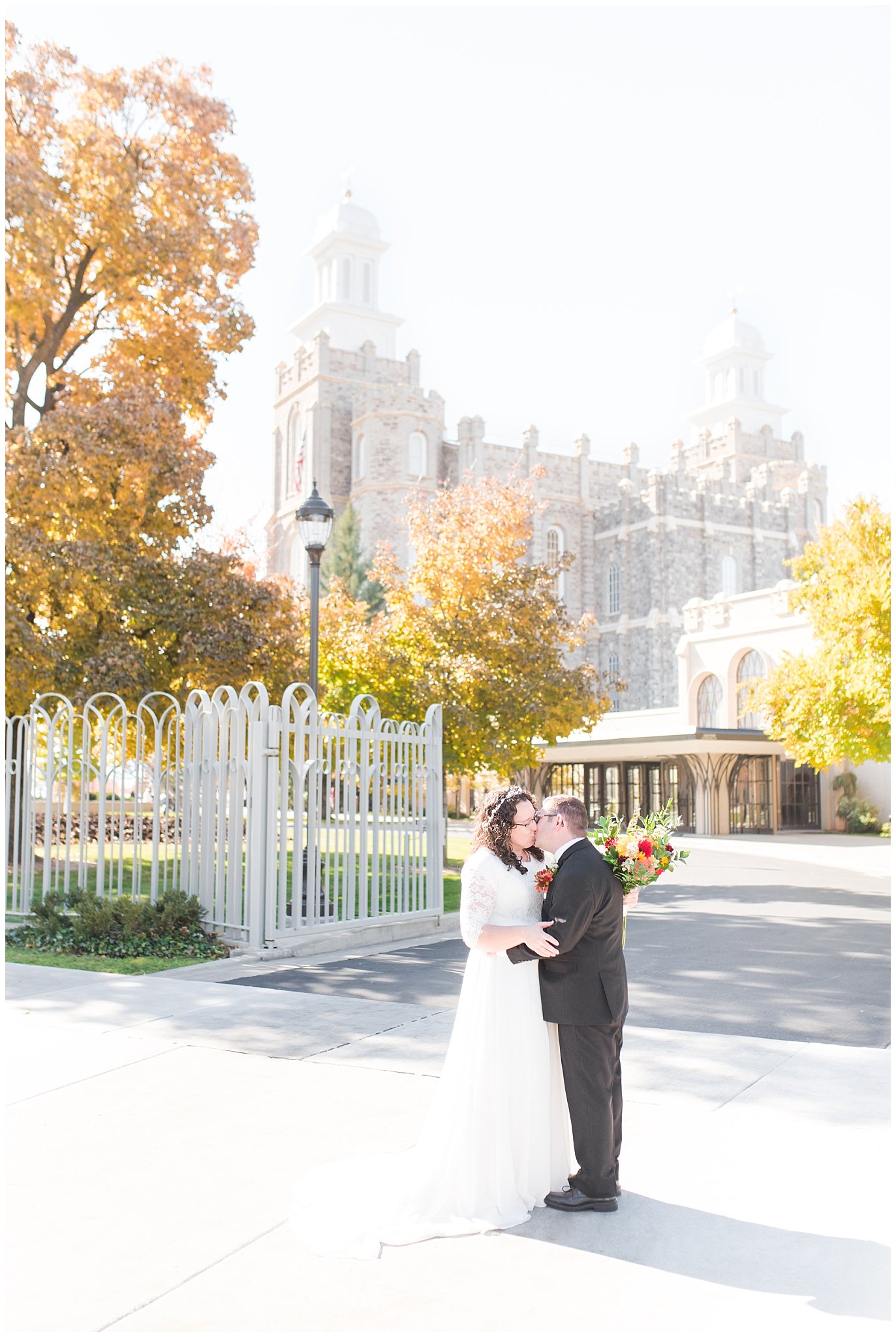 Bride and groom portraits in the fall at the Logan Temple | Logan Temple Fall Wedding and Logan Country Club Reception | Jessie and Dallin Photography