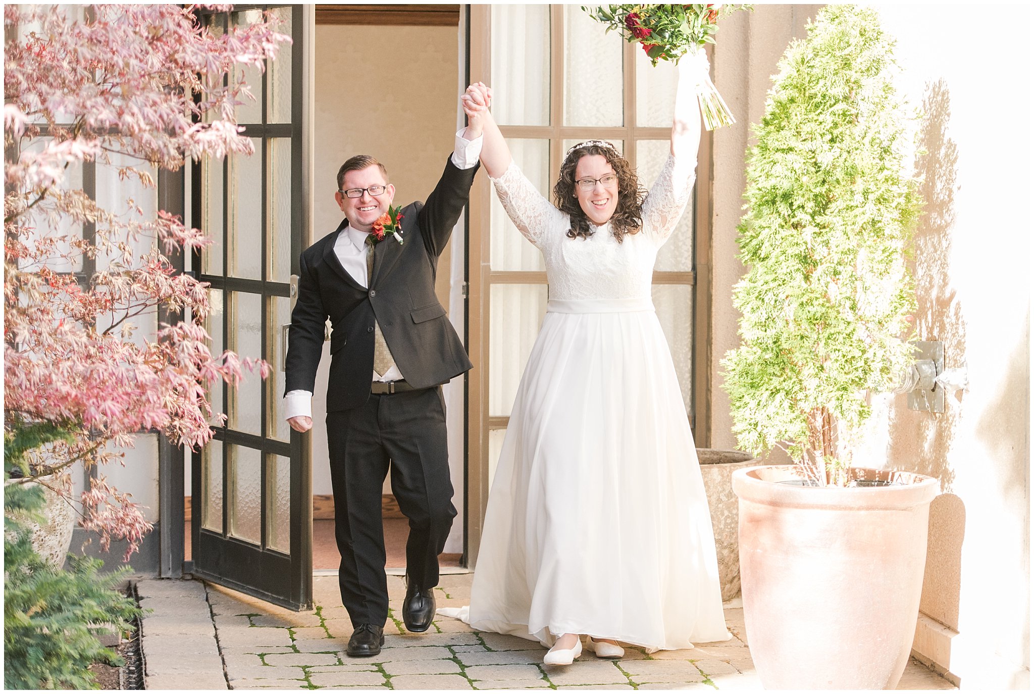Bride and groom exit the Logan Temple | Logan Temple Fall Wedding and Logan Country Club Reception | Jessie and Dallin Photography