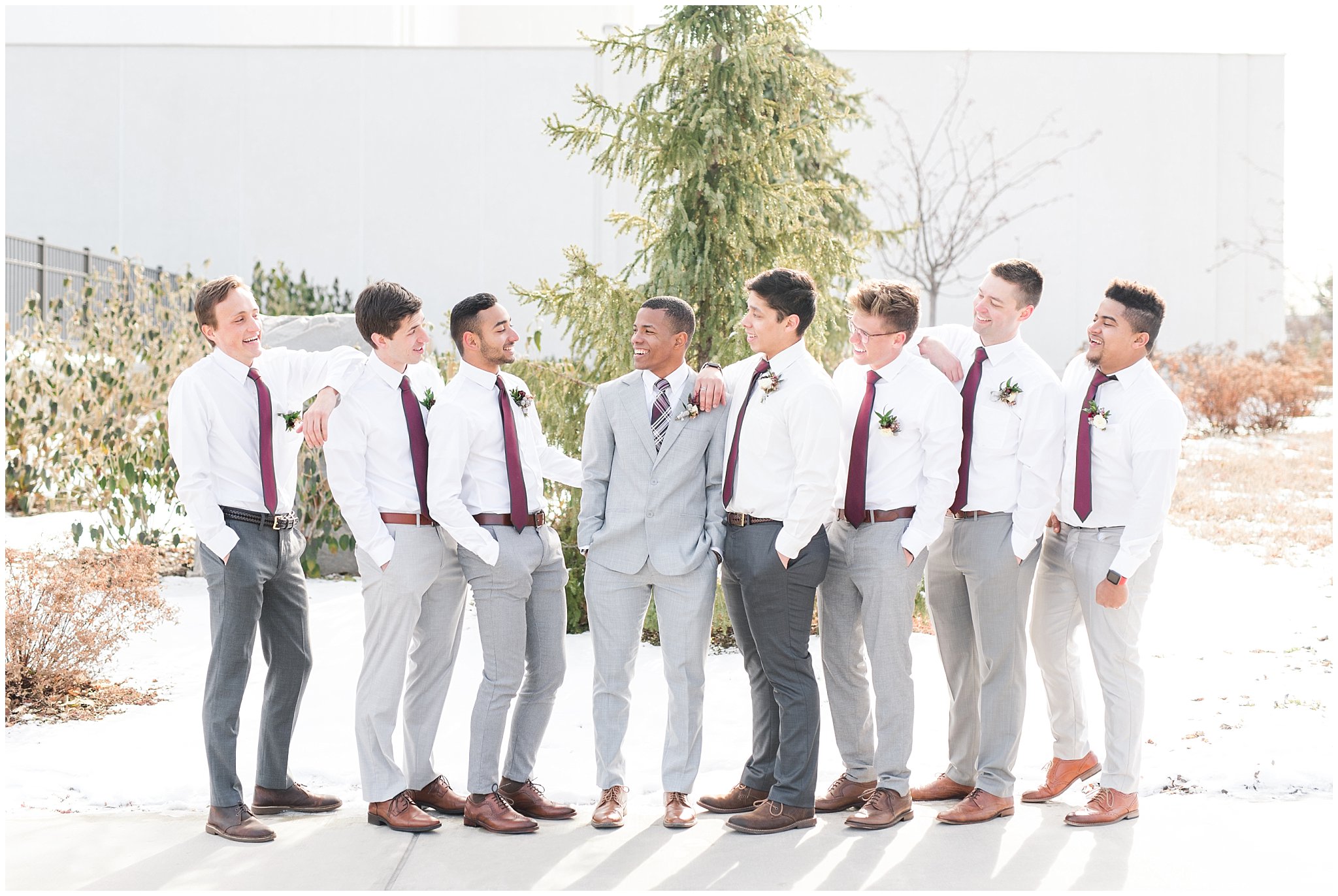 Bridal party photos in navy maxi dresses and burgundy ties at the Jordan River Temple | Burgundy and dusty rose bouquets | Jordan River Temple Winter Wedding | Jessie and Dallin Photography