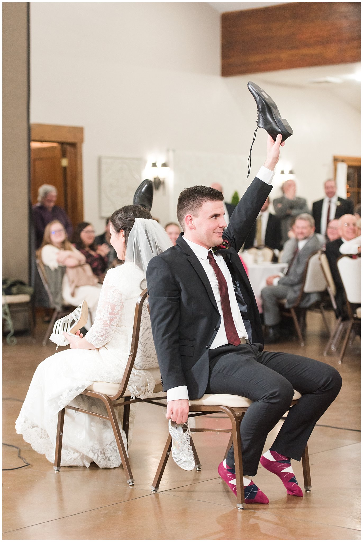 Bride and groom play the shoe game at the Gathering Place at Gardner Village | Gardner Village Wedding | The Gathering Place | Jessie and Dallin Photography