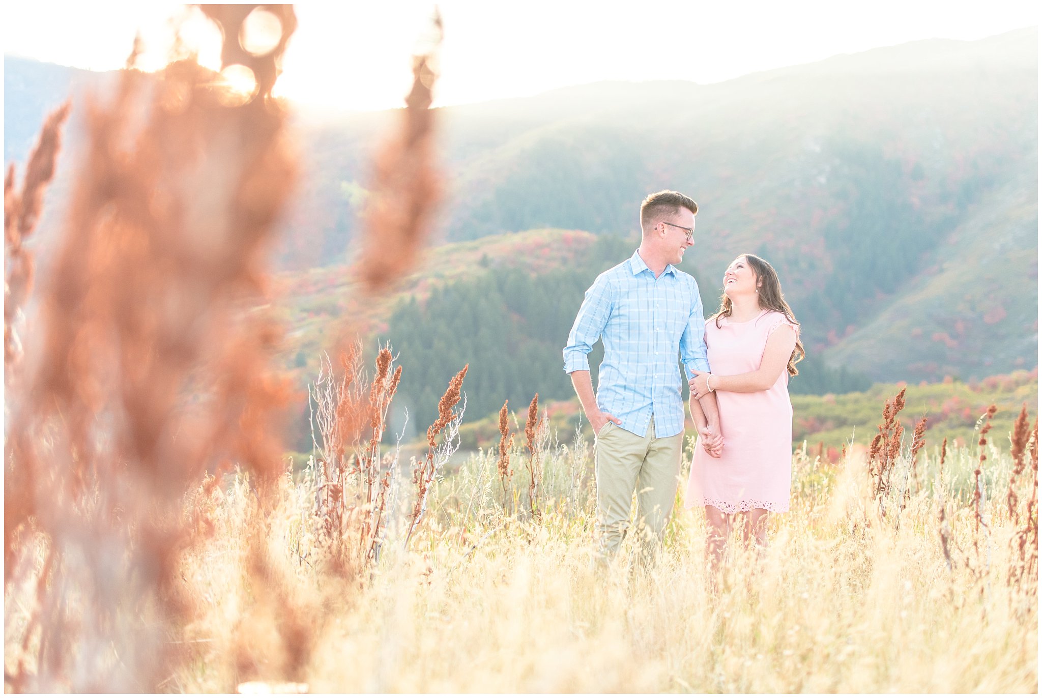 Couple walks through golden grass on top of a mountain during fall engagement in Utah | Top Utah Wedding and Couples Photos 2019 | Jessie and Dallin Photography
