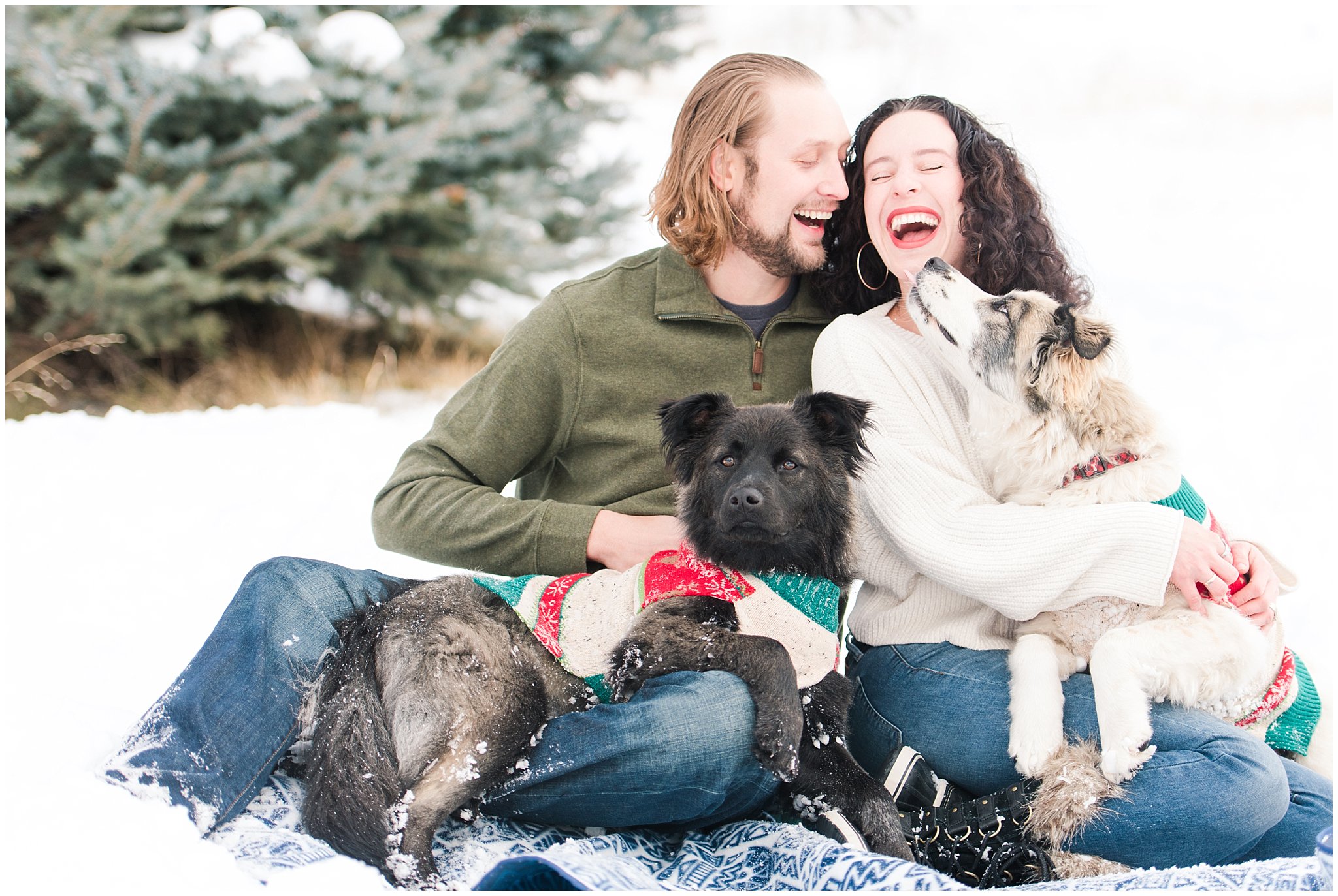 Couple laughing with puppies during winter engagement portrait session in the snow| Top Utah Wedding and Couples Photos 2019 | Jessie and Dallin Photography