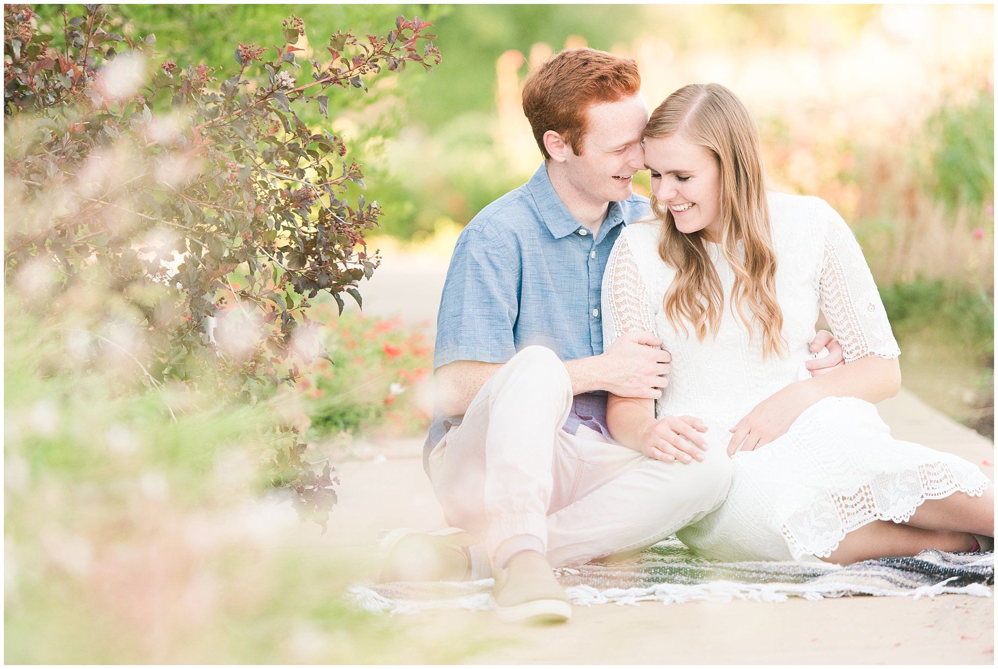 Couple sitting on a blanket during garden engagement session | Top Utah Wedding and Couples Photos 2019 | Jessie and Dallin Photography