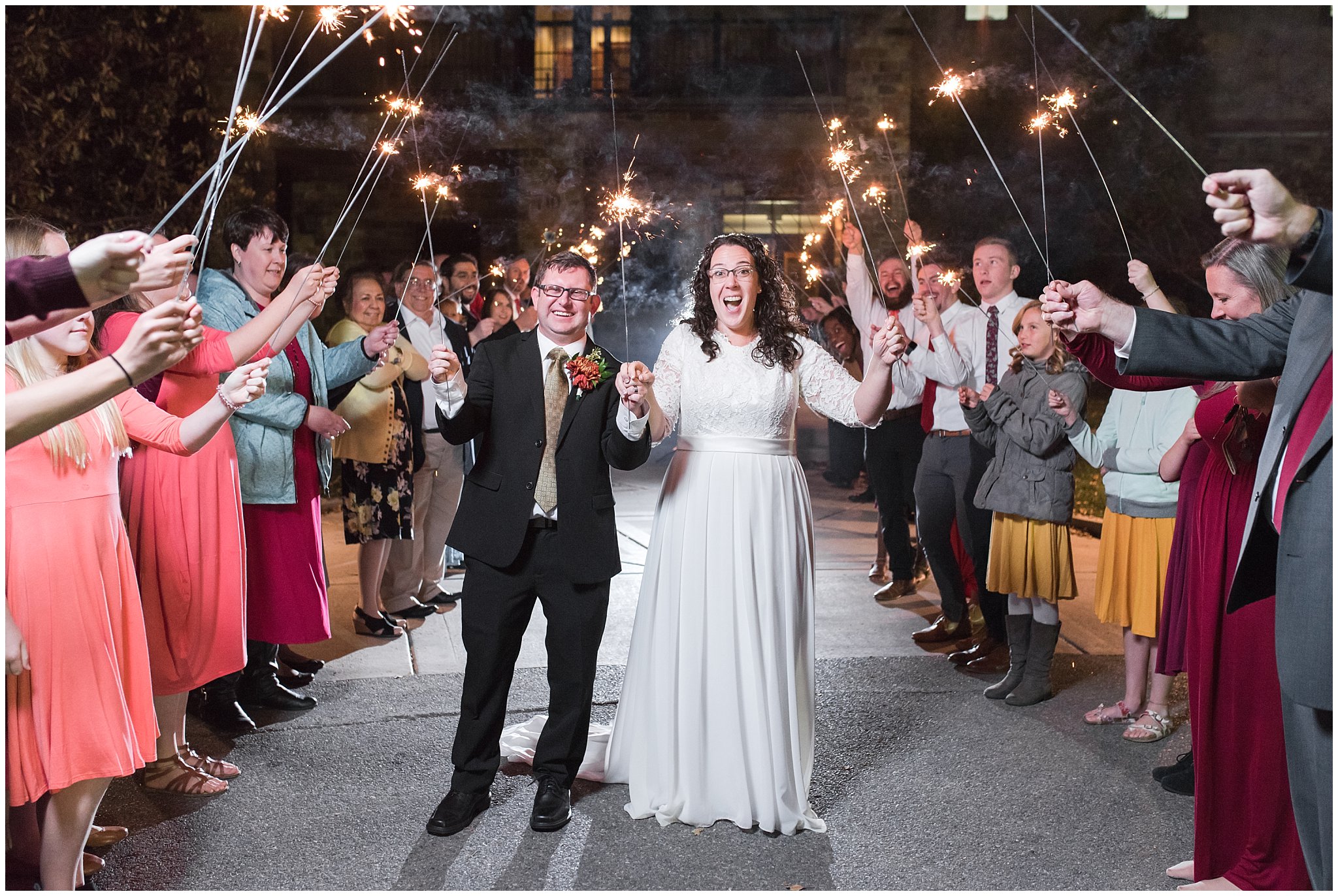 Bride and groom holding sparklers during sparkler exit sendoff in Logan Utah | Top Utah Wedding and Couples Photos 2019 | Jessie and Dallin Photography