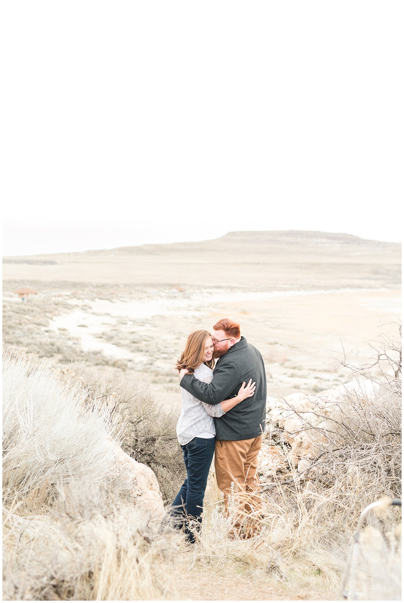 Couple in casual outfit at Antelope Island and the Great Salt Lake in the winter | Great Salt Lake Winter Engagement | Jessie and Dallin Photography