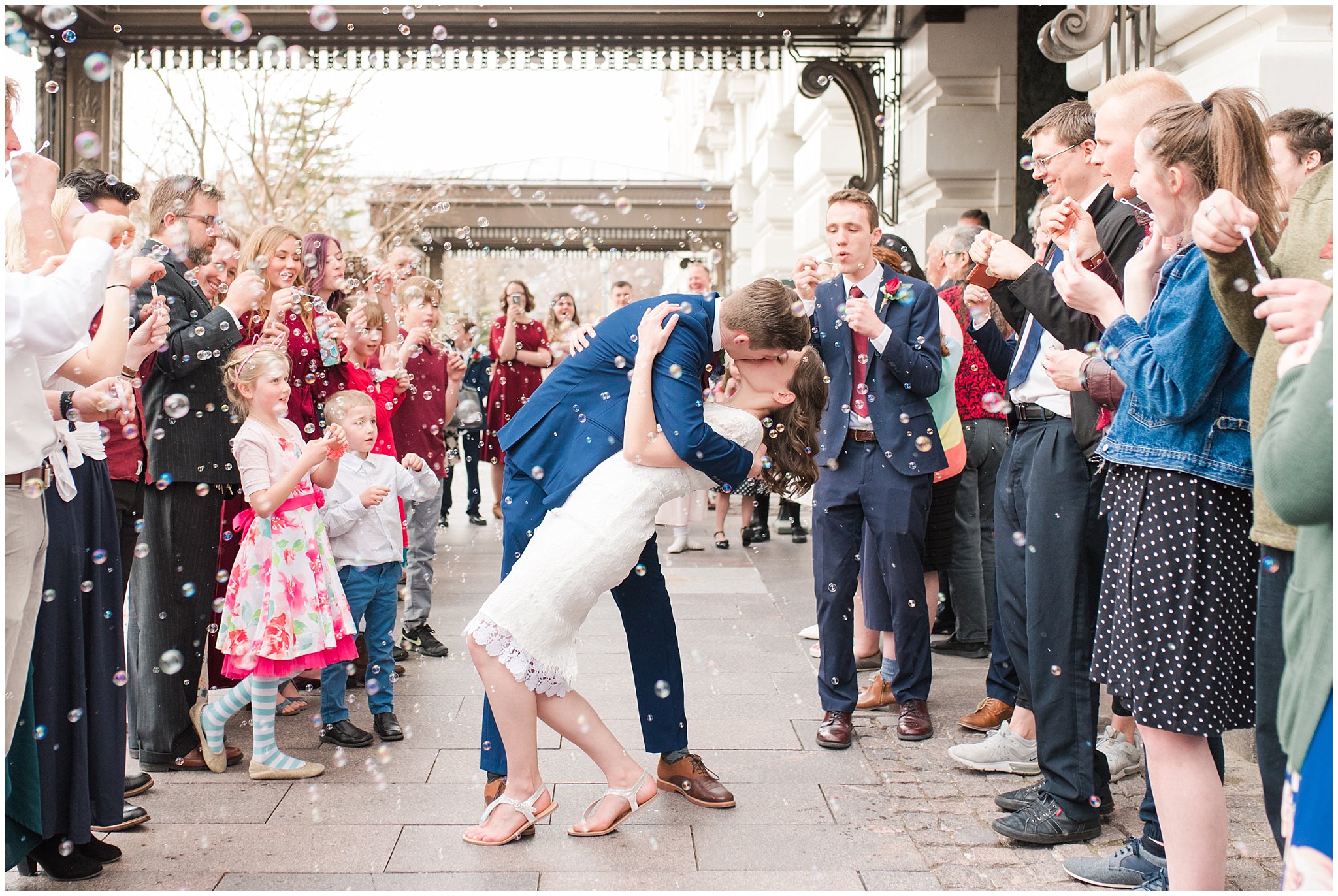 Bubble exit and sendoff at Joseph Smith Memorial Building | navy and burgundy colors | Bountiful Temple Wedding and Joseph Smith Memorial Reception | Jessie and Dallin Photography