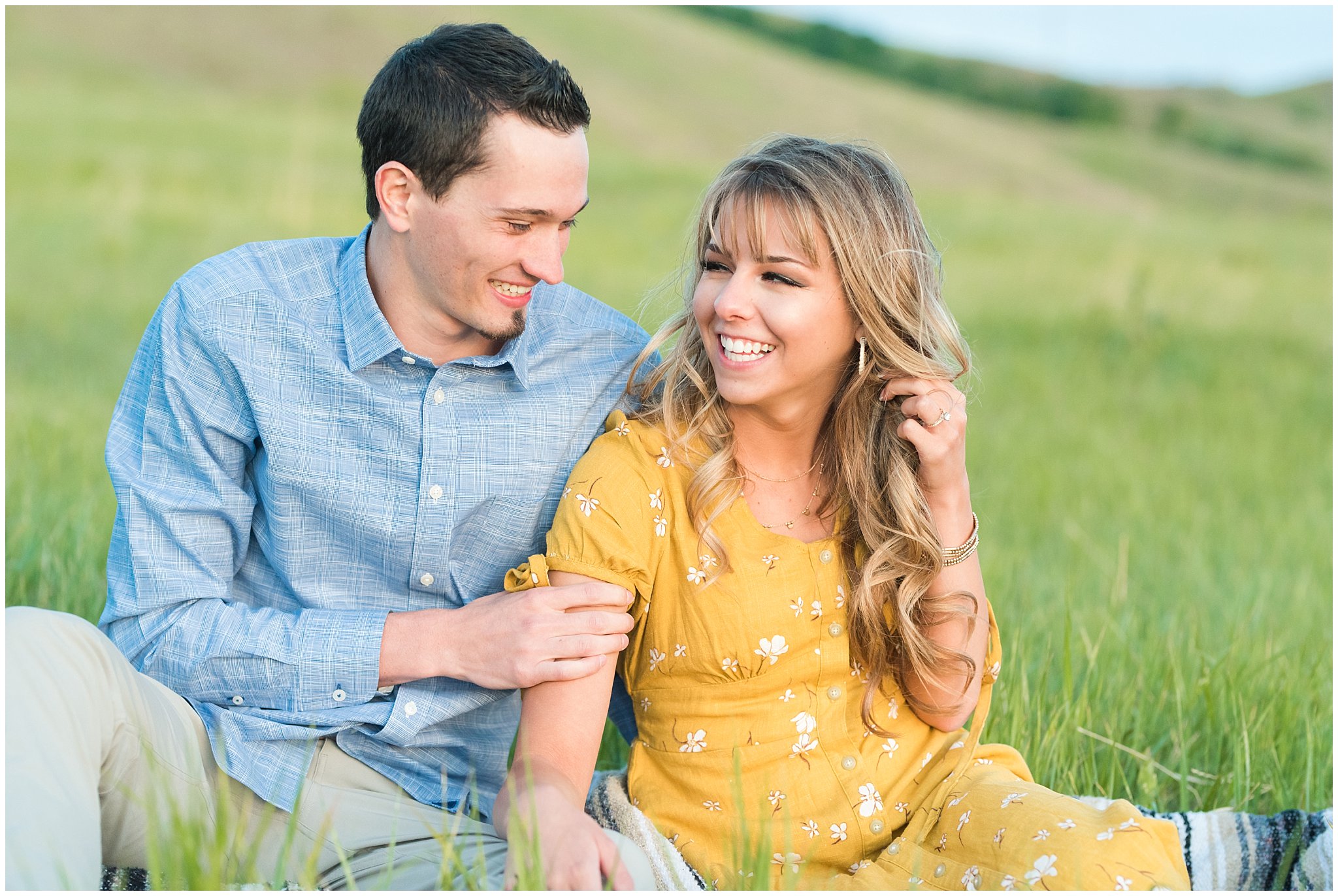 Couple in yellow dress and blue button up shirt on a grassy mountainside at Tunnel Springs | Utah State Capitol and Tunnel Springs Engagement Session | Jessie and Dallin Photography