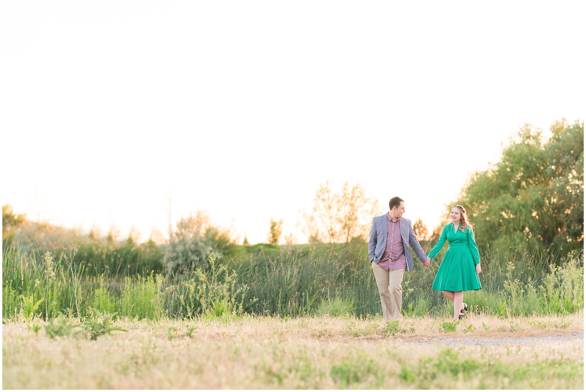 Couple in a garden for their engagement session with a vintage 1950s dress | Summer USU Botanical Garden Engagement Session | Jessie and Dallin Photography