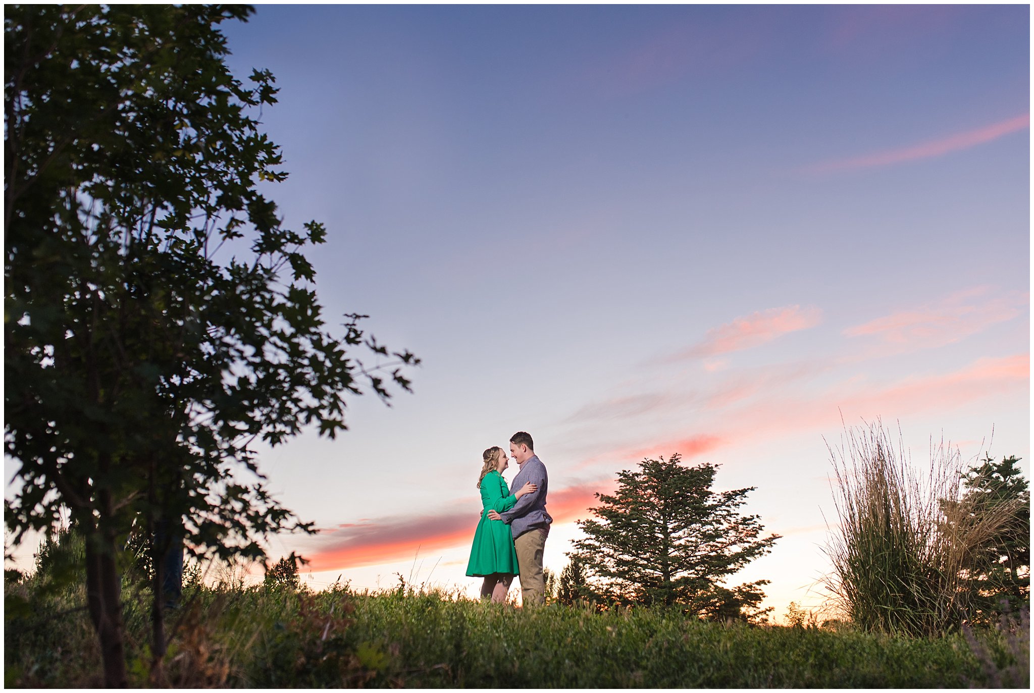 Couple at sunset in a garden for their engagement session with a vintage 1950s dress | Summer USU Botanical Garden Engagement Session | Jessie and Dallin Photography