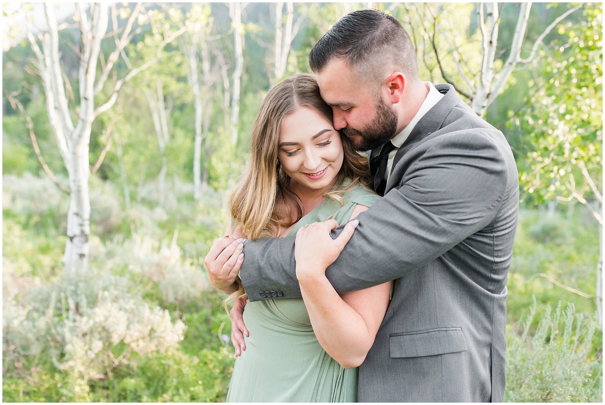 Couple in sage green dress and grey suit in aspen trees | Tibble Fork Summer Engagement Session | Jessie and Dallin Photography