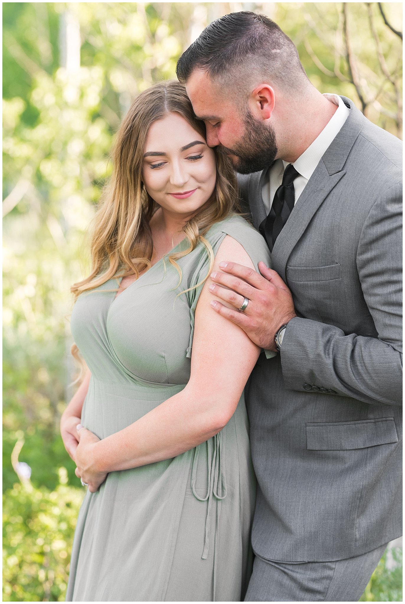 Couple in sage green dress and grey suit in aspen trees | Tibble Fork Summer Engagement Session | Jessie and Dallin Photography