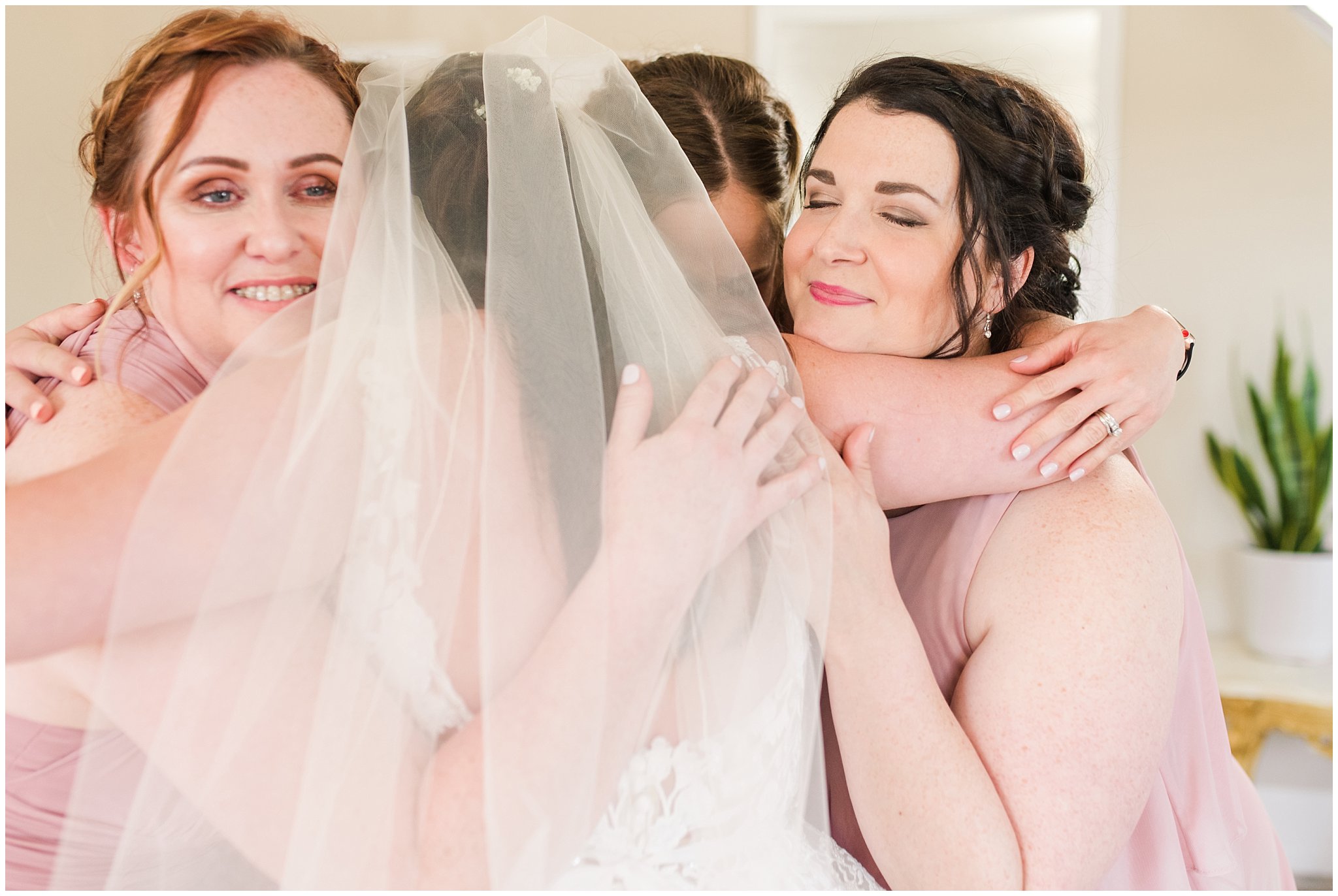 Bride hugging bridesmaids after first look | Oak Hills Utah Dusty Rose and Gray Summer Wedding | Jessie and Dallin Photography