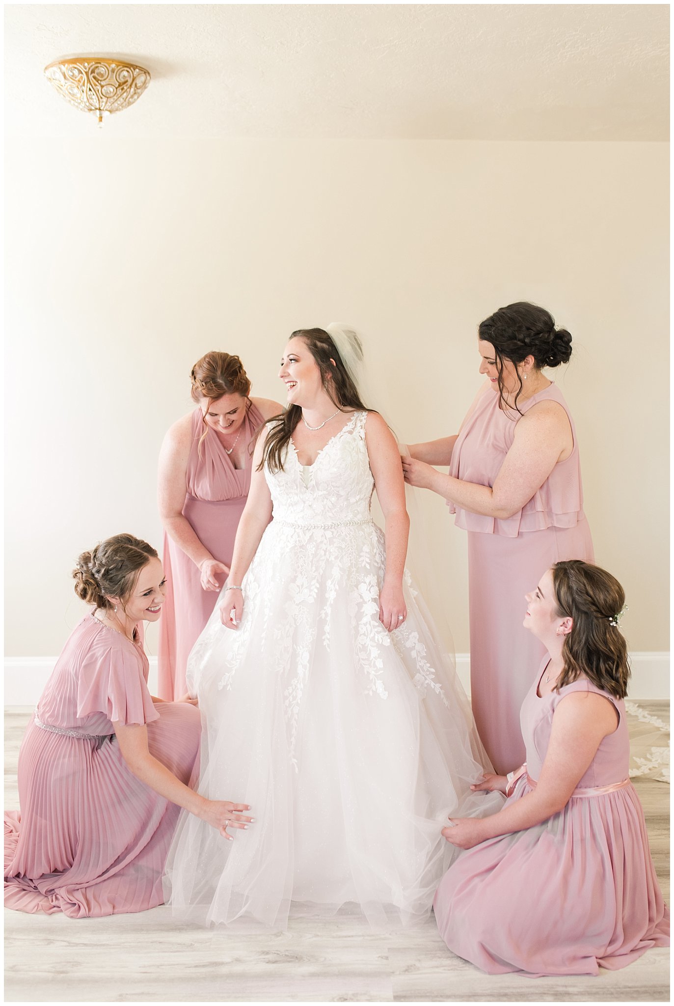Bride with bridesmaids in dusty rose dresses getting ready | Oak Hills Utah Dusty Rose and Gray Summer Wedding | Jessie and Dallin Photography