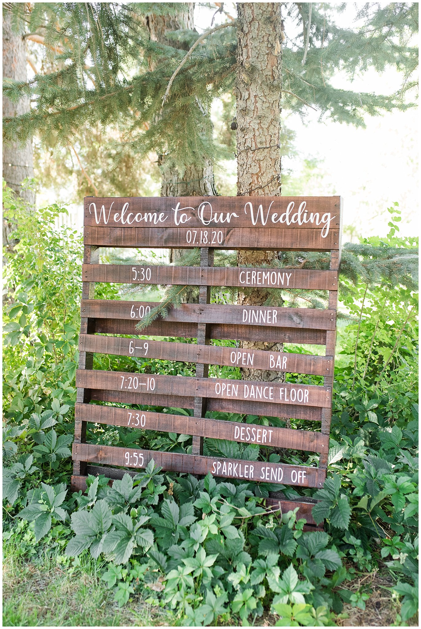 Wooden palate with wedding timeline decoration | Oak Hills Utah Dusty Rose and Gray Summer Wedding | Jessie and Dallin Photography