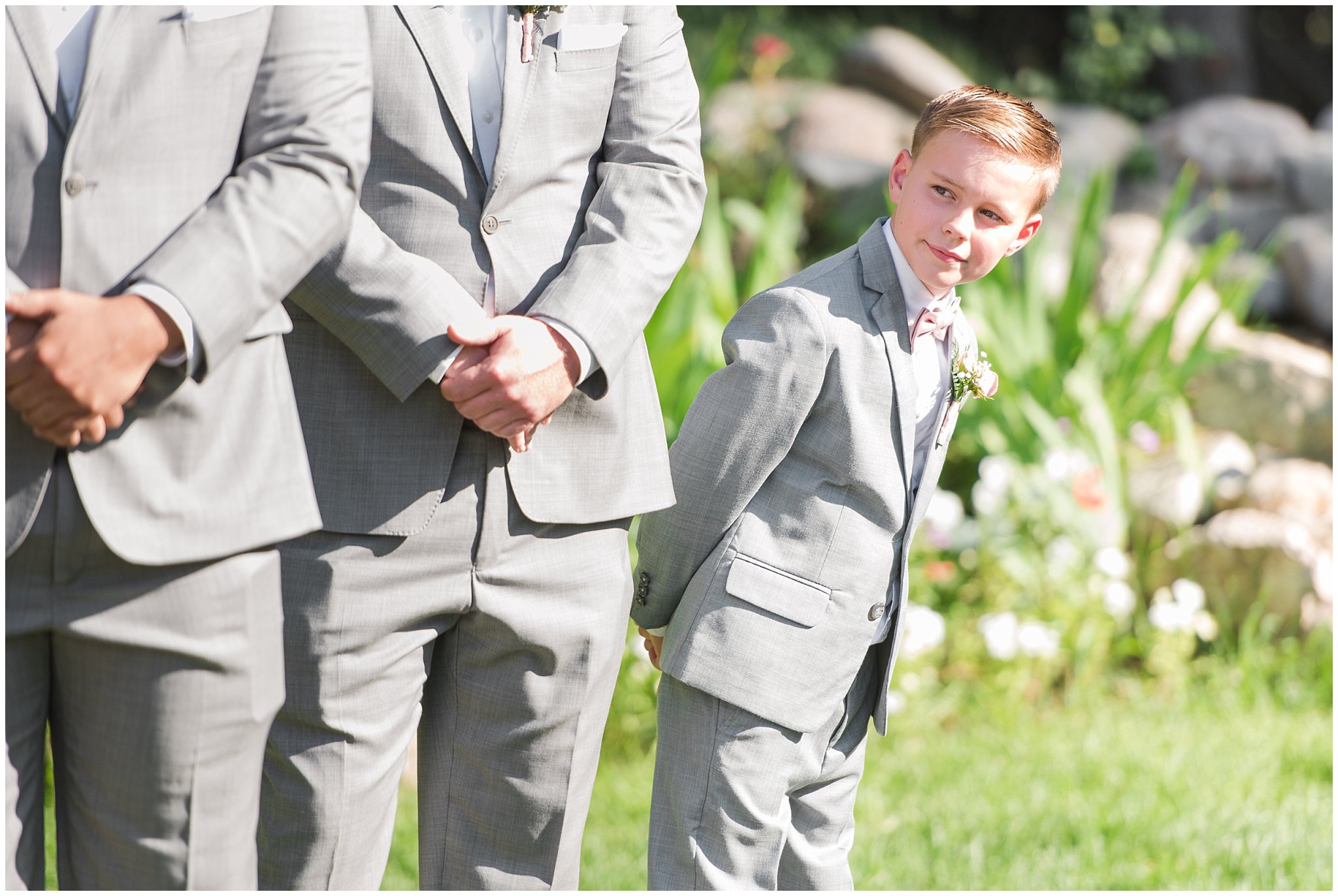 Junior groomsmen watches ceremony | Oak Hills Utah Dusty Rose and Gray Summer Wedding | Jessie and Dallin Photography