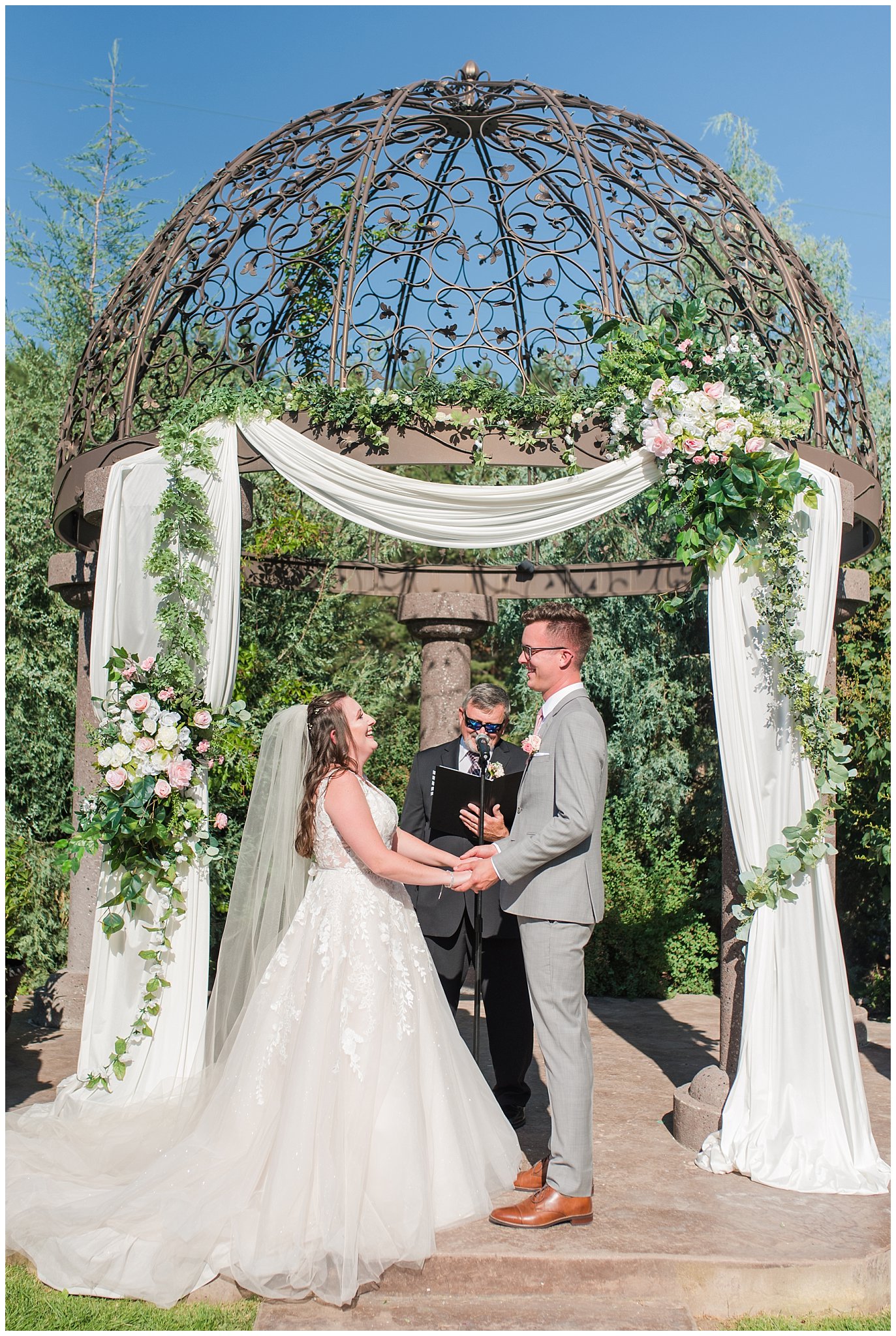 Bride and groom laugh during ceremony | Oak Hills Utah Dusty Rose and Gray Summer Wedding | Jessie and Dallin Photography
