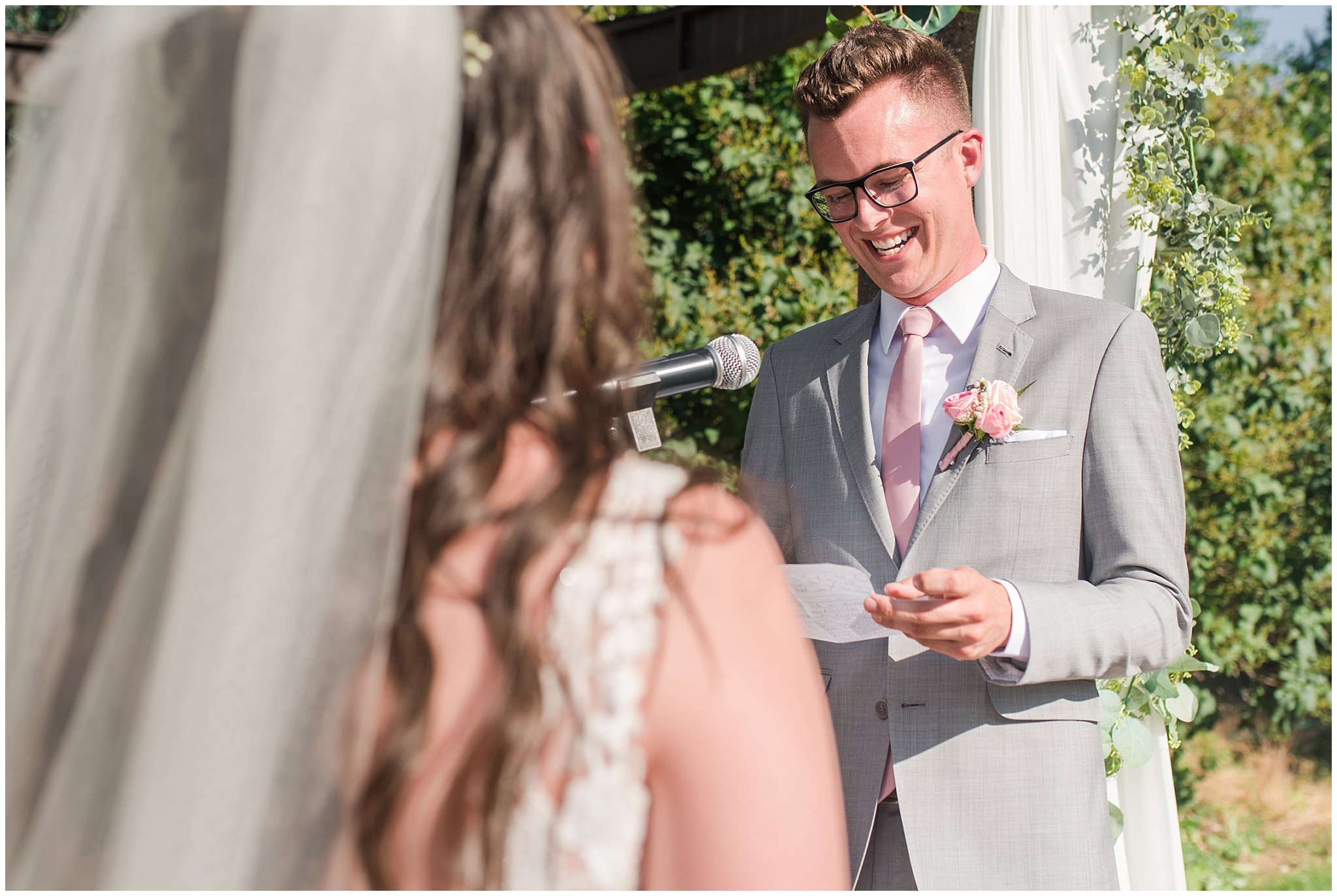 Groom reads vows during ceremony | Oak Hills Utah Dusty Rose and Gray Summer Wedding | Jessie and Dallin Photography