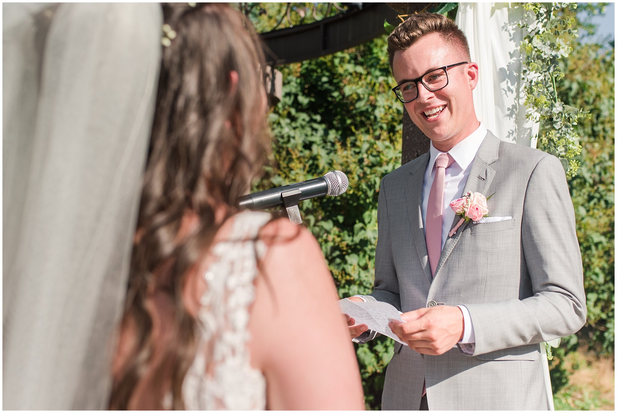 Groom reacts to vows during ceremony | Oak Hills Utah Dusty Rose and Gray Summer Wedding | Jessie and Dallin Photography