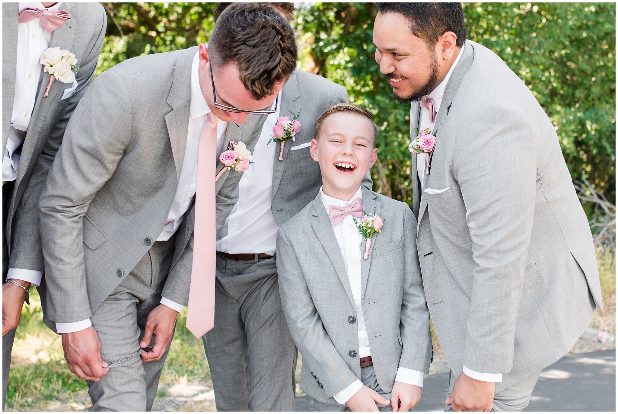 Groom and groomsmen laugh in gray suits with blush ties | Oak Hills Utah Dusty Rose and Gray Summer Wedding | Jessie and Dallin Photography