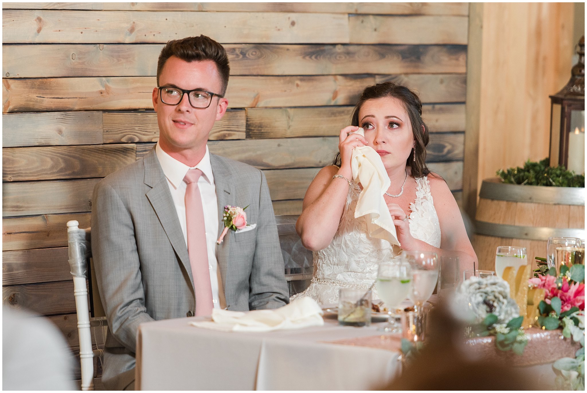 Bride and groom during toasts at dinner | Oak Hills Utah Dusty Rose and Gray Summer Wedding | Jessie and Dallin Photography