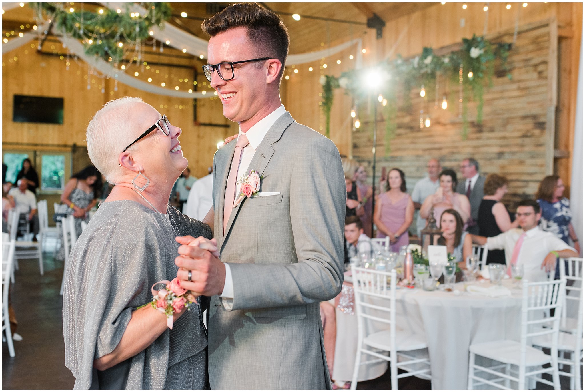 Mother son dance in barn | Oak Hills Utah Dusty Rose and Gray Summer Wedding | Jessie and Dallin Photography