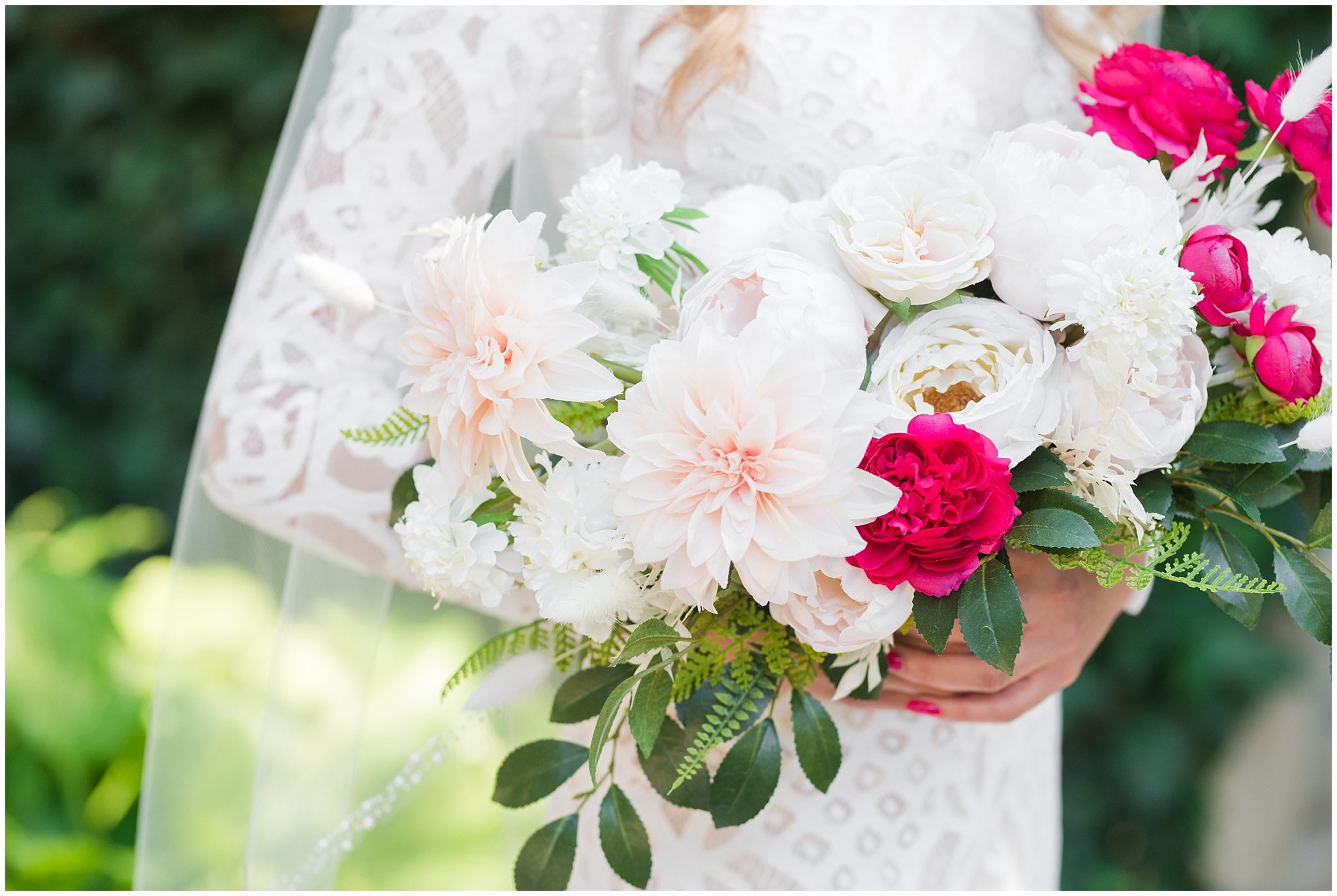 Bride in lace dress holding bouquet of white and deep pink florals | Wadley Farms Summer Wedding | Jessie and Dallin Photography