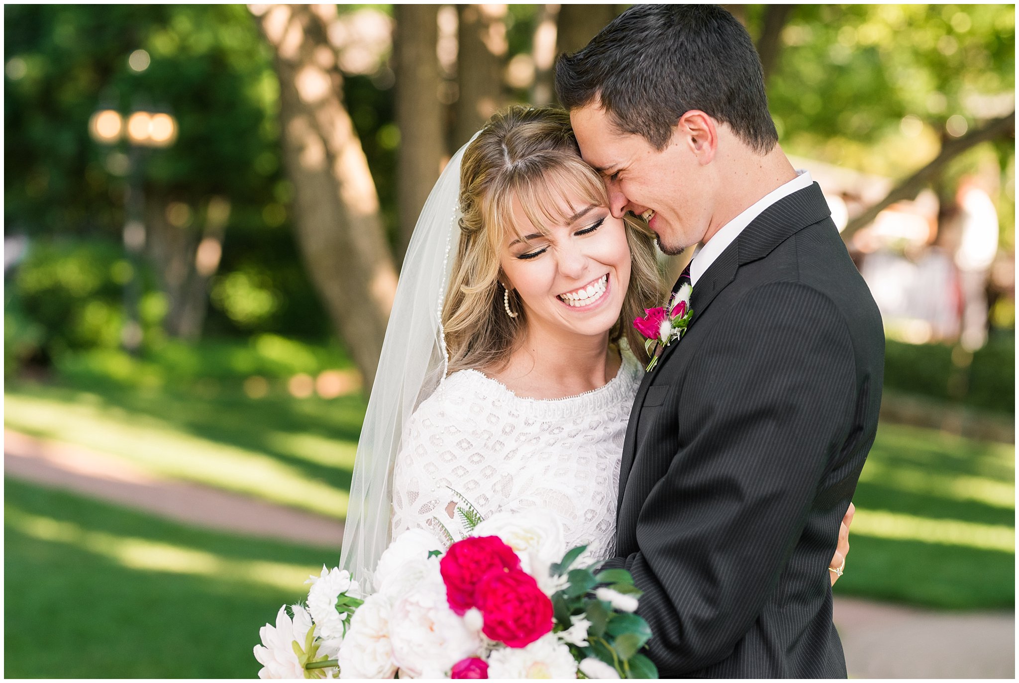 Bride and groom portraits candid moments laughing | white and deep pink florals with black suit and lace dress | Wadley Farms Summer Wedding | Jessie and Dallin Photography