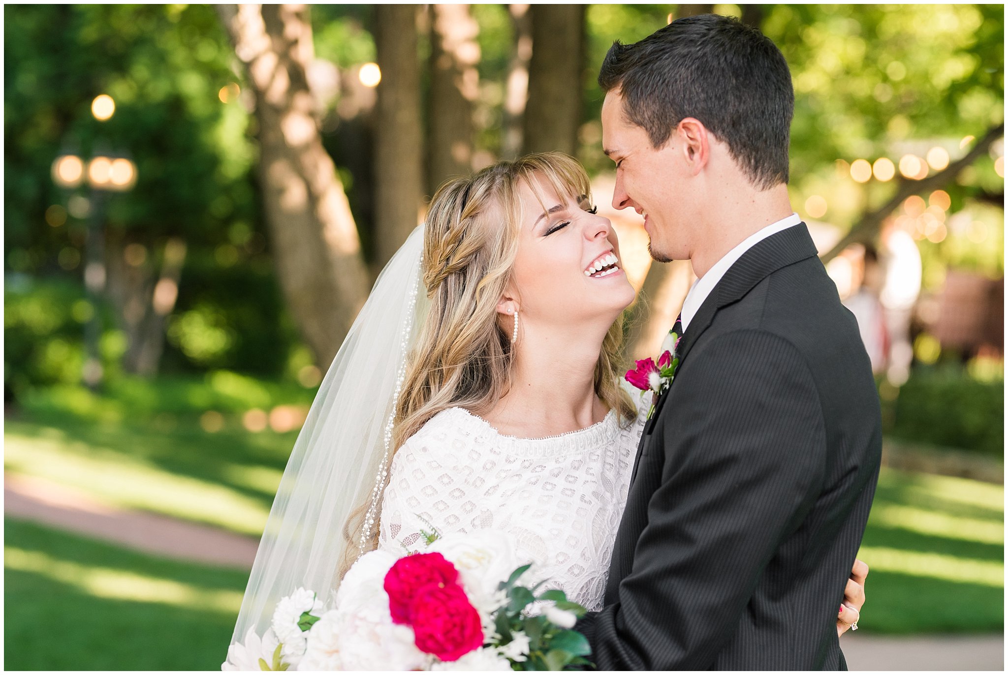 Bride and groom portraits candid moments laughing | white and deep pink florals with black suit and lace dress | Wadley Farms Summer Wedding | Jessie and Dallin Photography