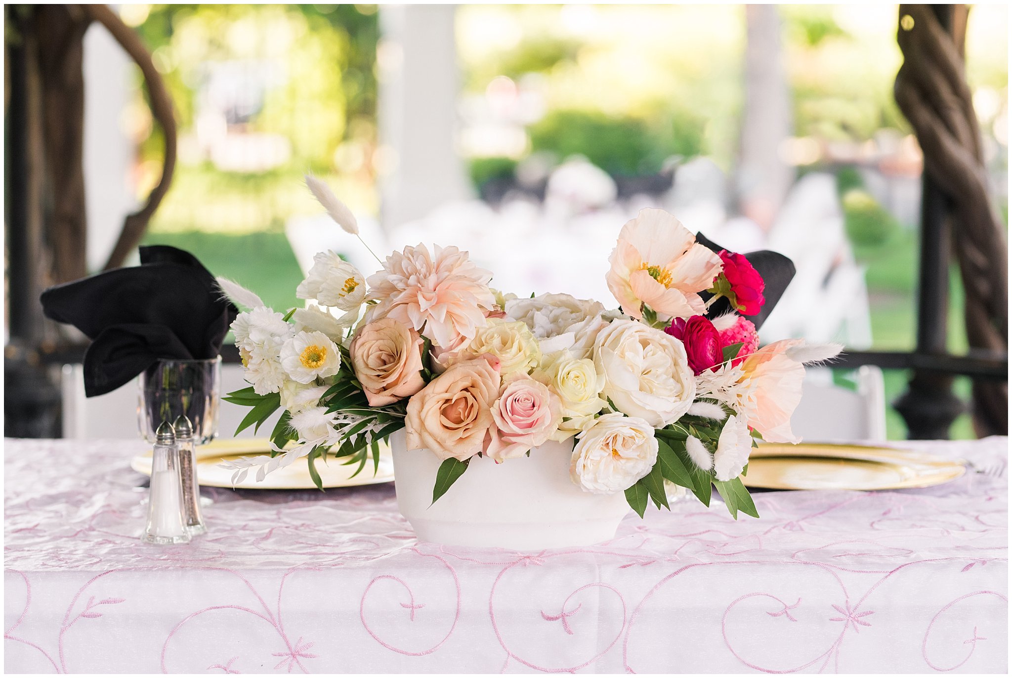 Table place setting for dinner with golden plates, white and deep pink florals in the garden | Wadley Farms Summer Wedding | Jessie and Dallin Photography