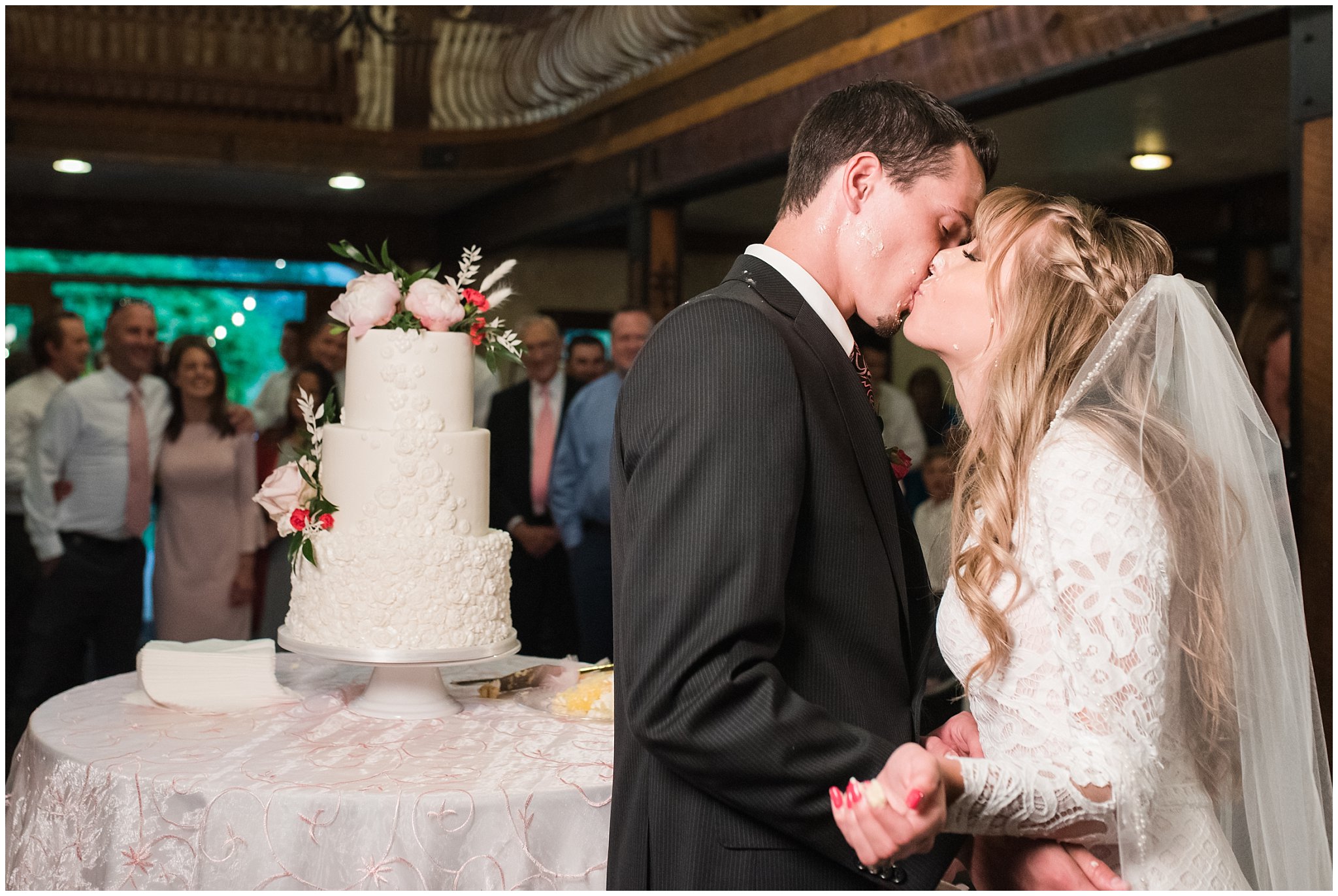 Caking cutting and smashing during reception in the barn | Wadley Farms Summer Wedding | Jessie and Dallin Photography