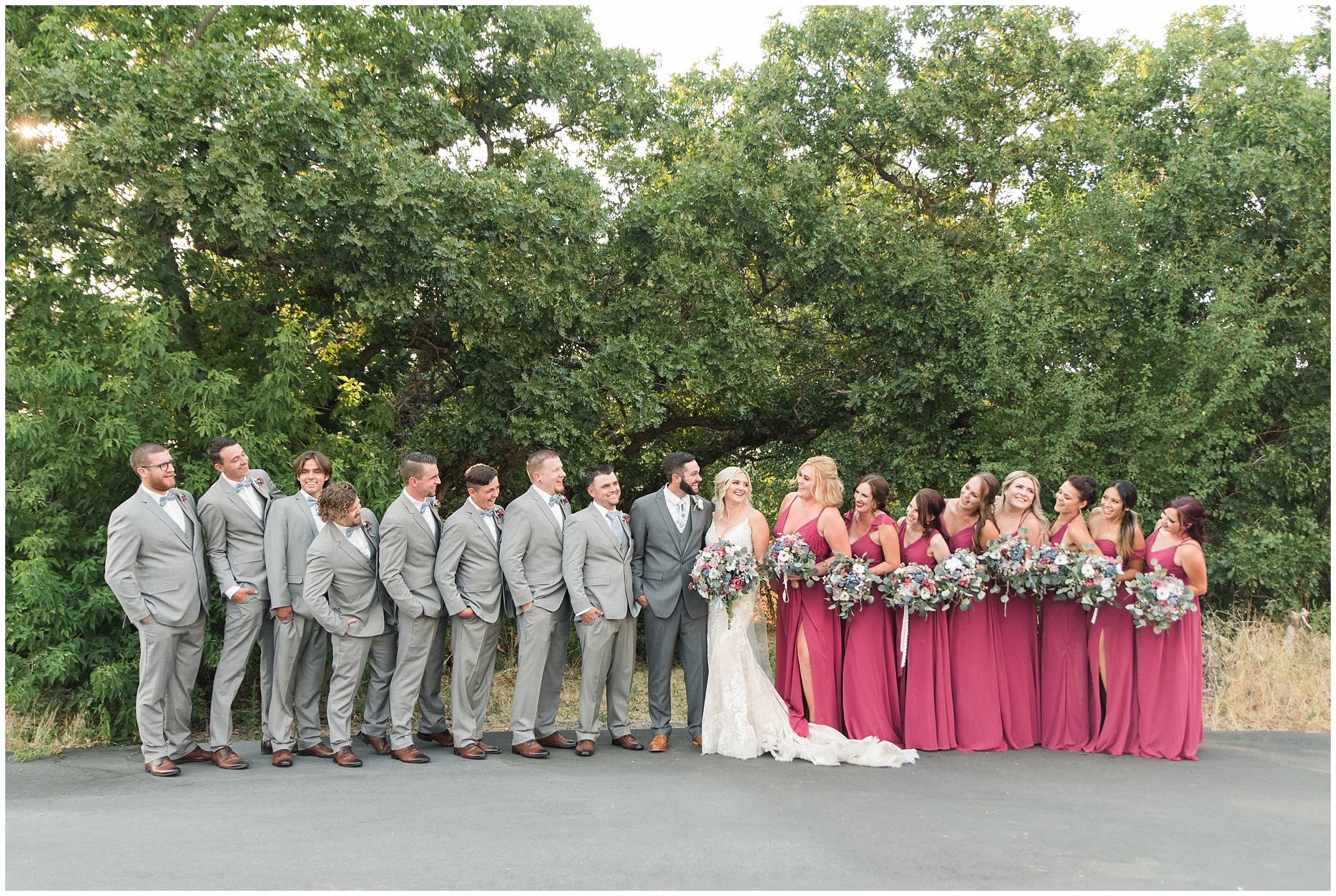 Wedding party wearing gray suits and blue ties and maroon dresses | Dusty Blue and Rose Summer Wedding at Oak Hills Utah | Jessie and Dallin Photography