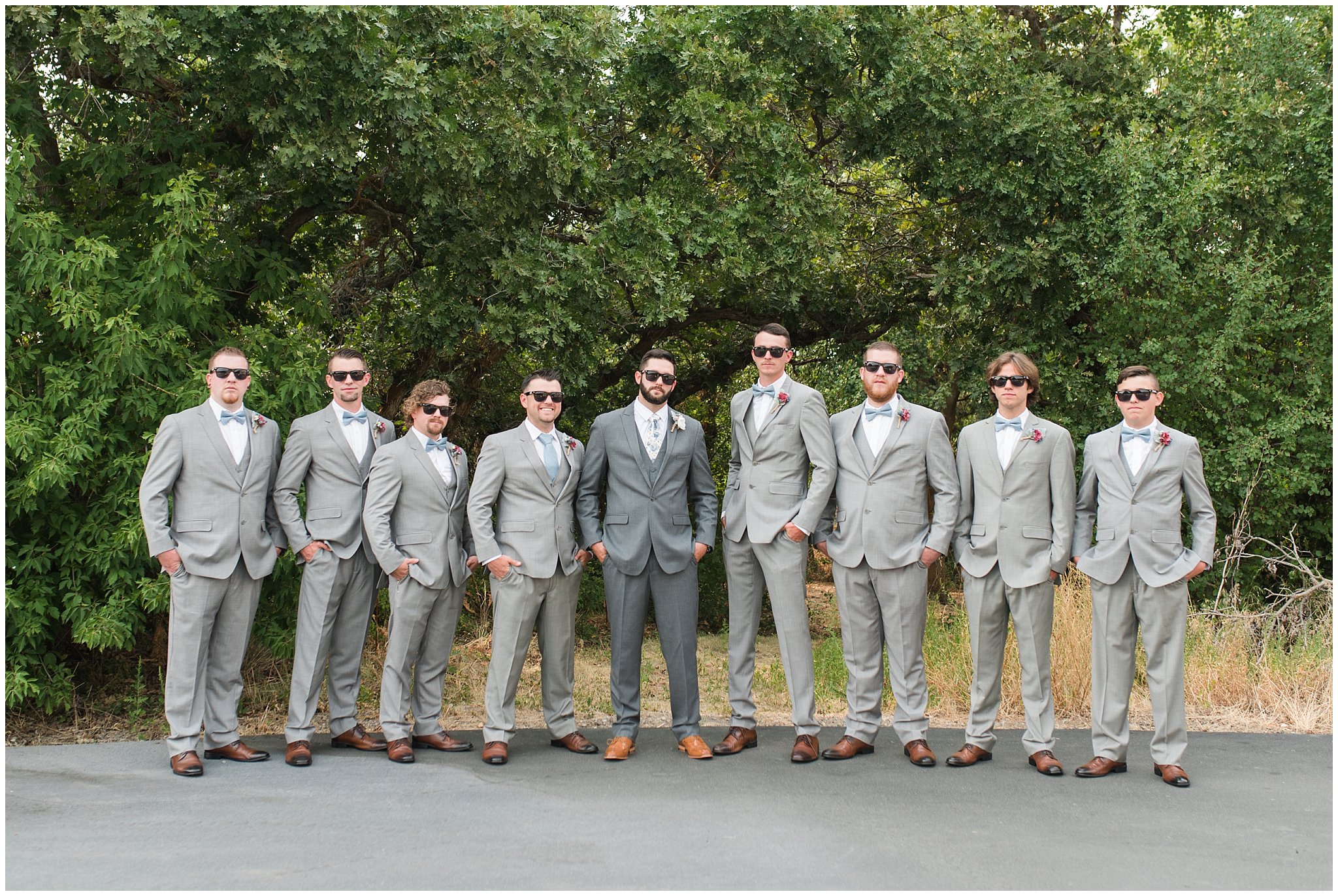 Groom and groomsmen wearing gray suits and blue floral ties with custom sunglasses | Dusty Blue and Rose Summer Wedding at Oak Hills Utah | Jessie and Dallin Photography