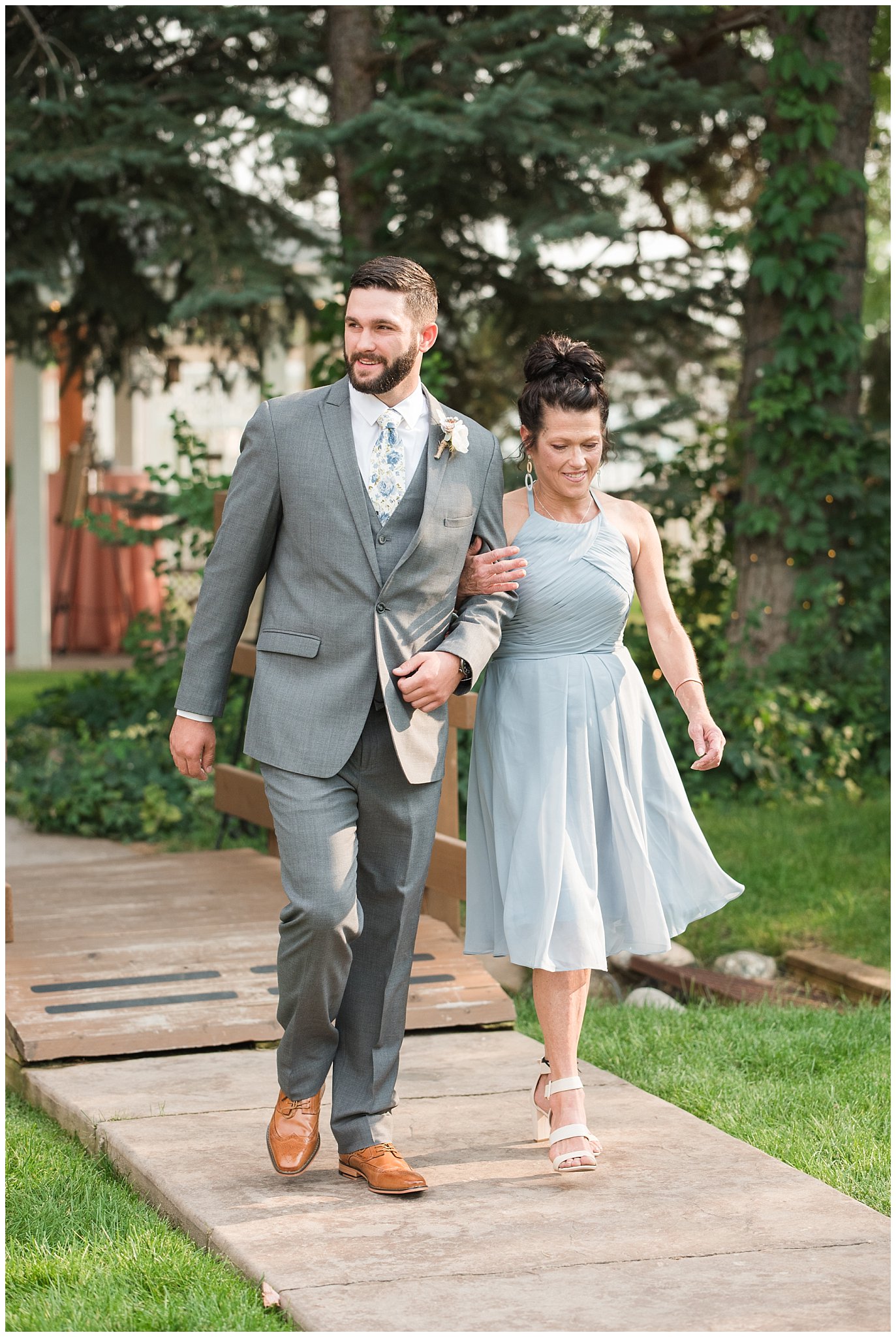 Groom walking down the aisle with mom | Dusty Blue and Rose Summer Wedding at Oak Hills Utah | Jessie and Dallin Photography