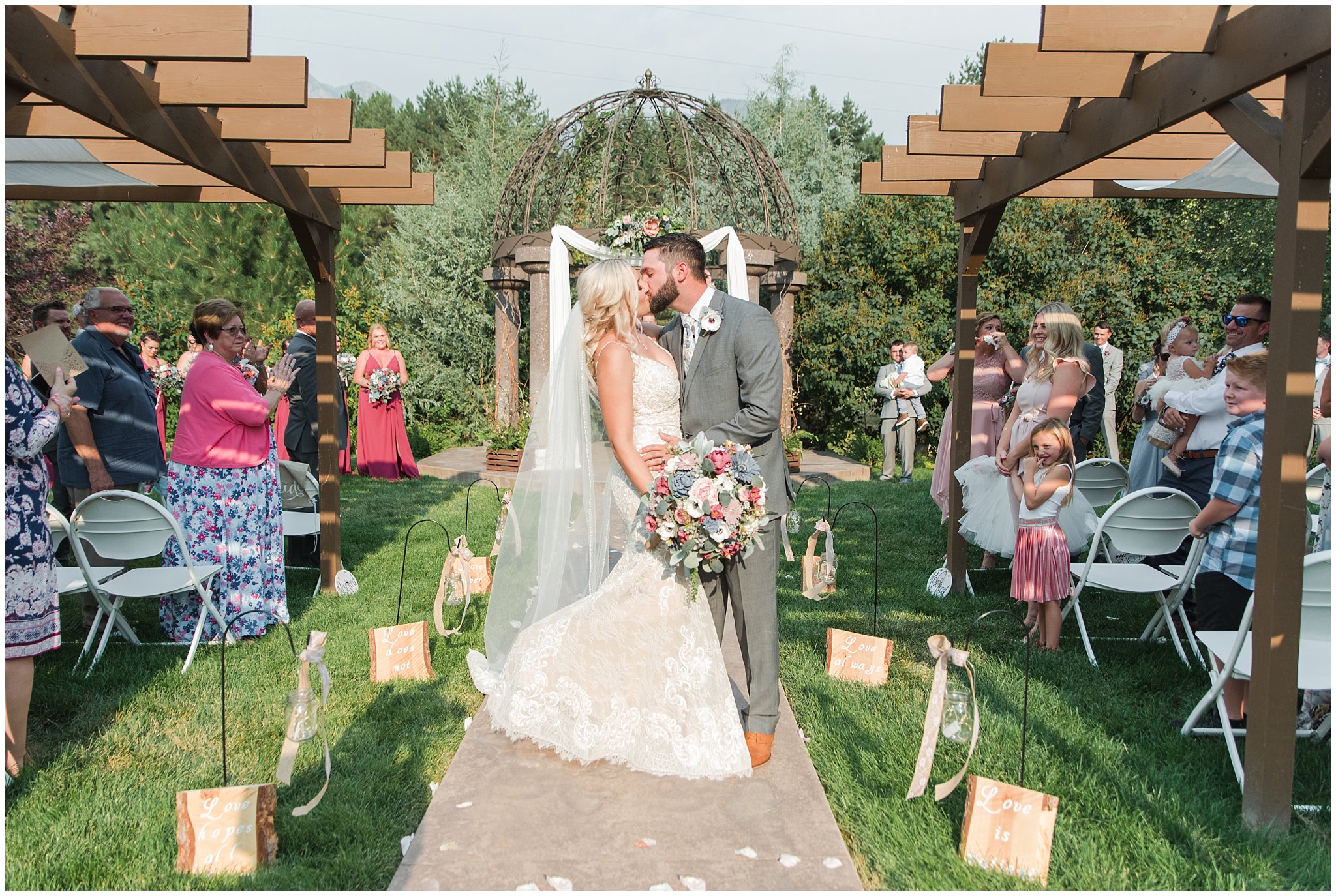 First kiss during wedding ceremony | Dusty Blue and Rose Summer Wedding at Oak Hills Utah | Jessie and Dallin Photography