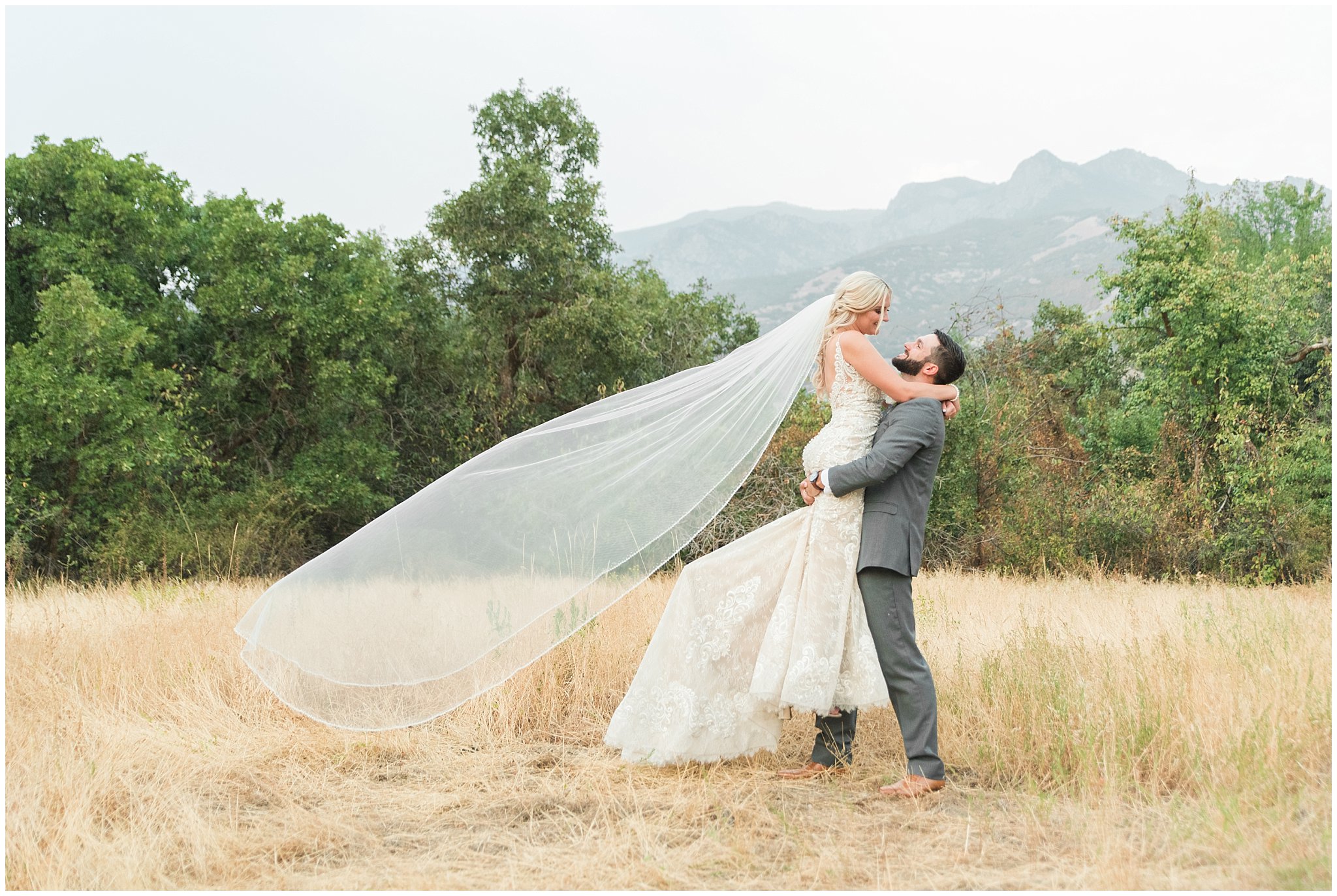 Bride and groom portraits with lace dress and cathedral veil and gray suit with blue floral tie | Dusty Blue and Rose Summer Wedding at Oak Hills Utah | Jessie and Dallin Photography