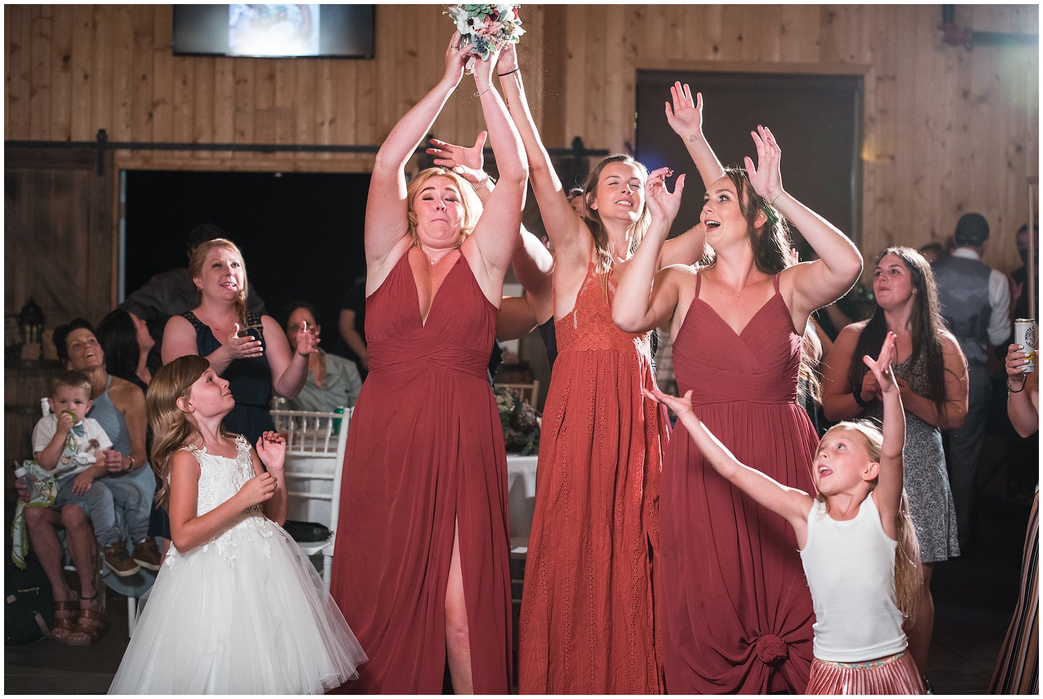 Bouquet toss in barn | Dusty Blue and Rose Summer Wedding at Oak Hills Utah | Jessie and Dallin Photography