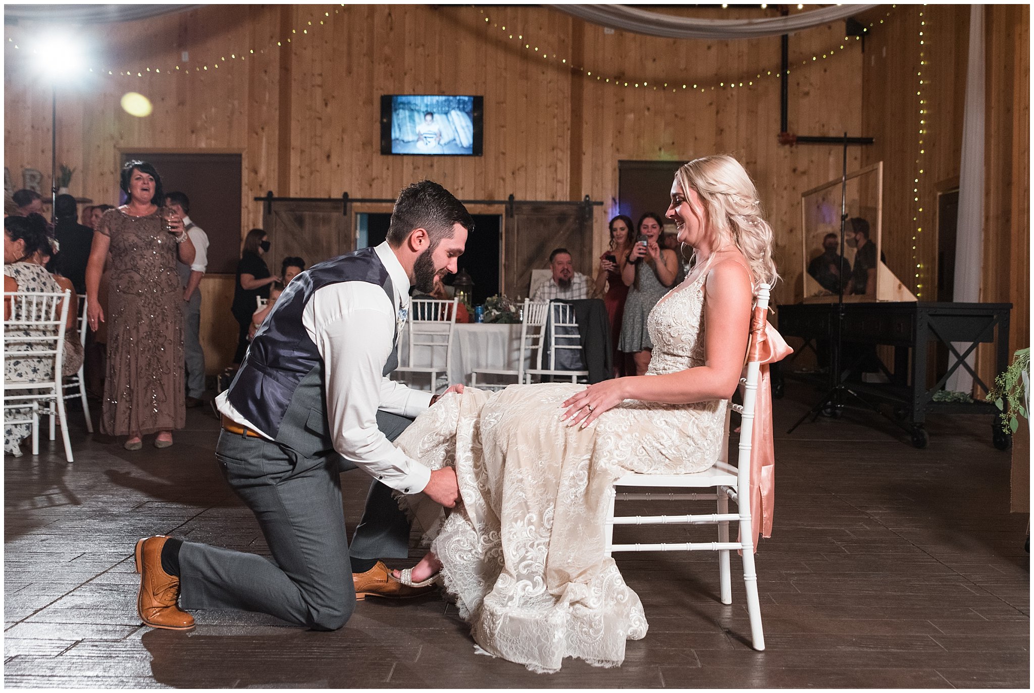 Garter toss in barn | Dusty Blue and Rose Summer Wedding at Oak Hills Utah | Jessie and Dallin Photography