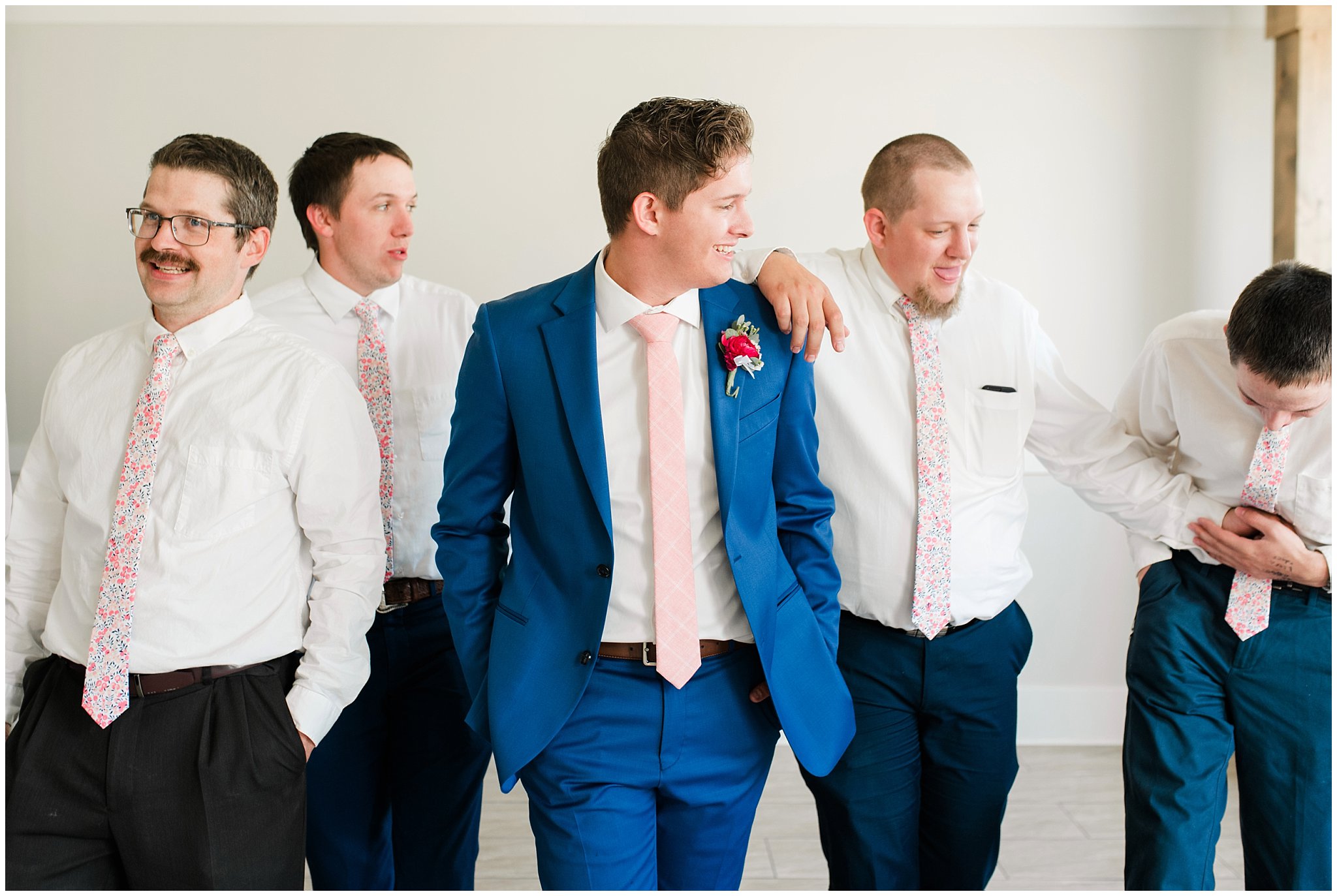Groom and groomsmen in floral pink ties | Talia Event Center Summer Wedding | Jessie and Dallin Photography