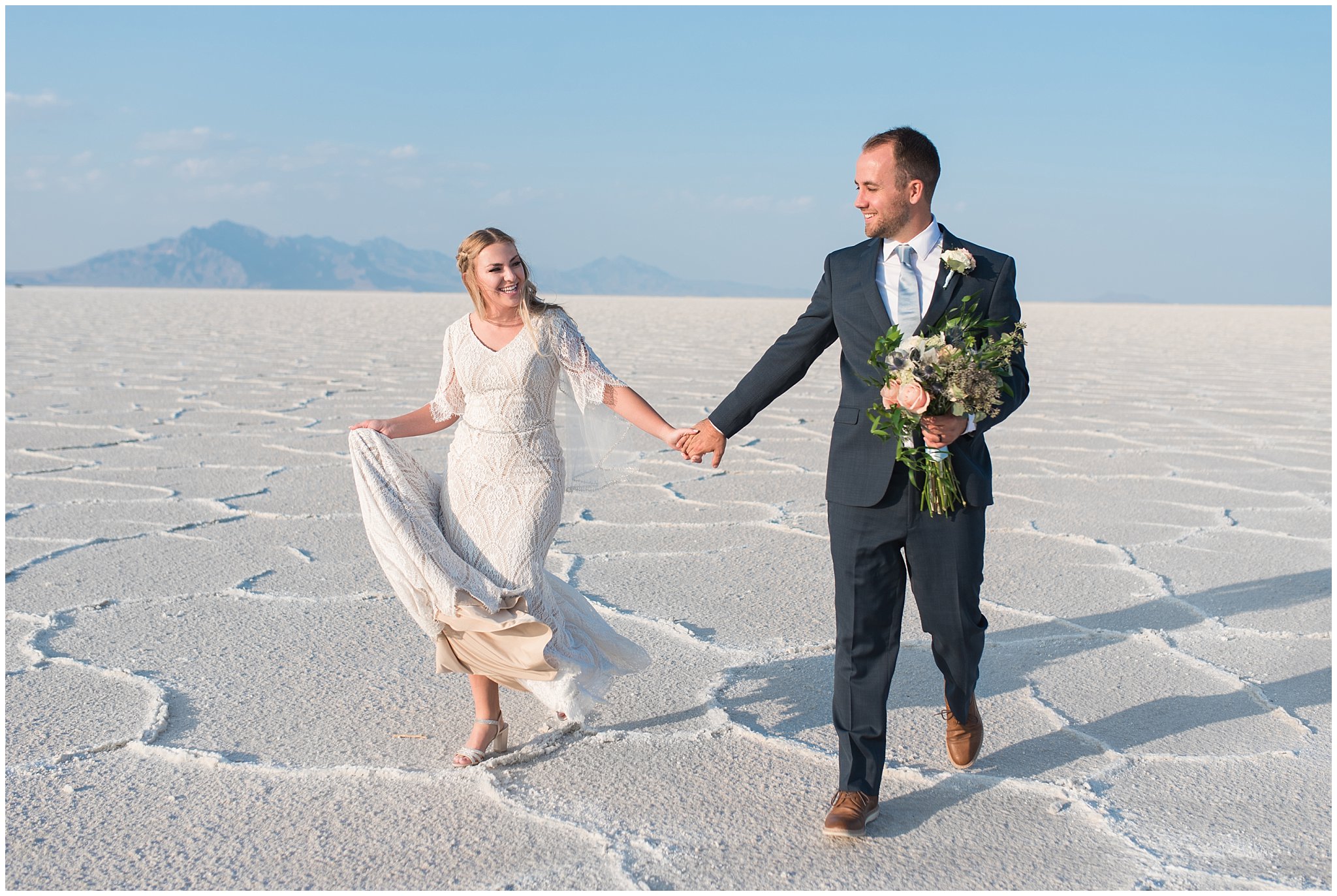 Bride and Groom in lace detail dress and blue suit for Adventure Session | Bonneville Salt Flats Sunset Wedding Formal Session | Jessie and Dallin Photography