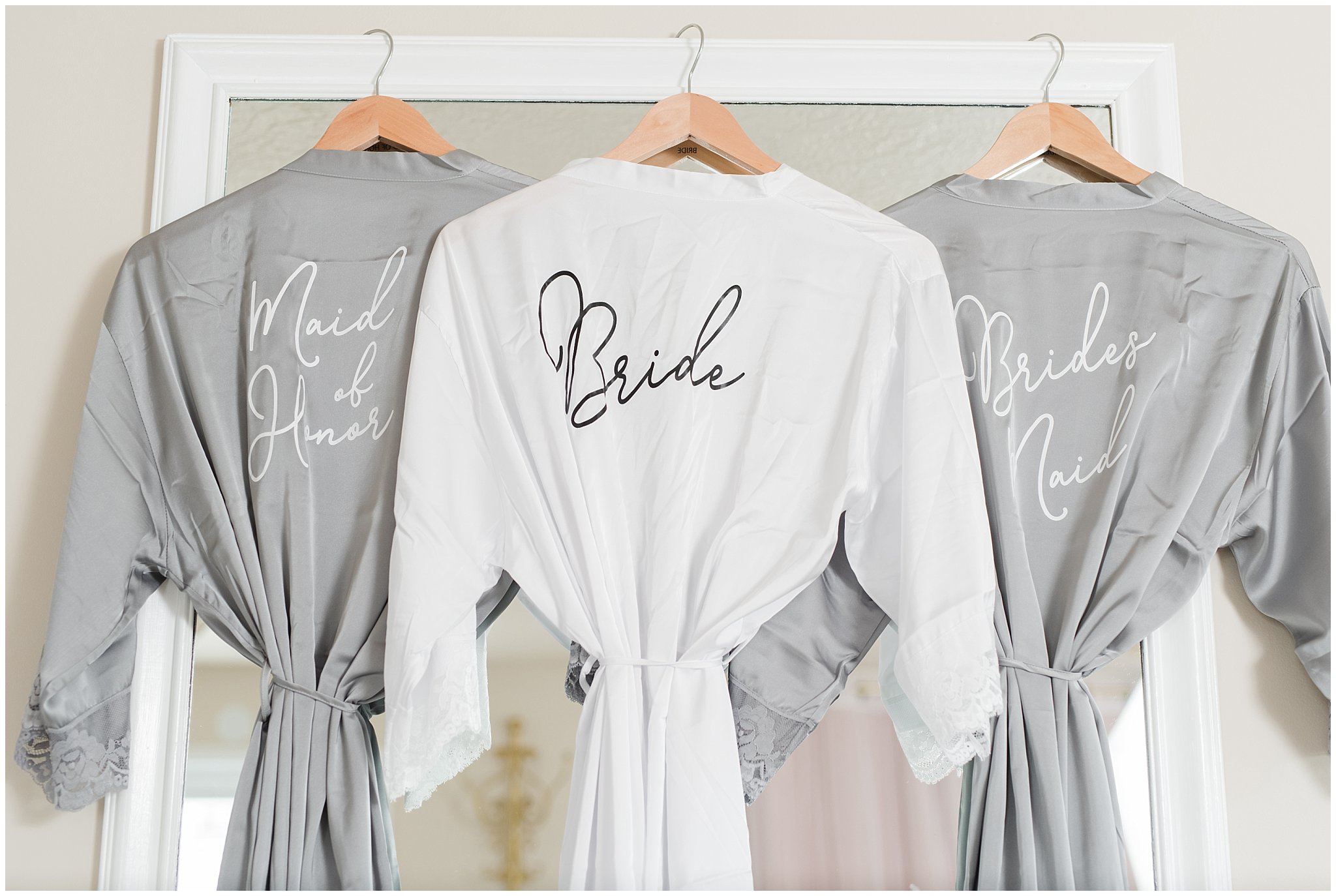 Gray and white bridesmaid robes with names on the back | Sage Green and Gray Summer Wedding at Oak Hills | Jessie and Dallin Photography